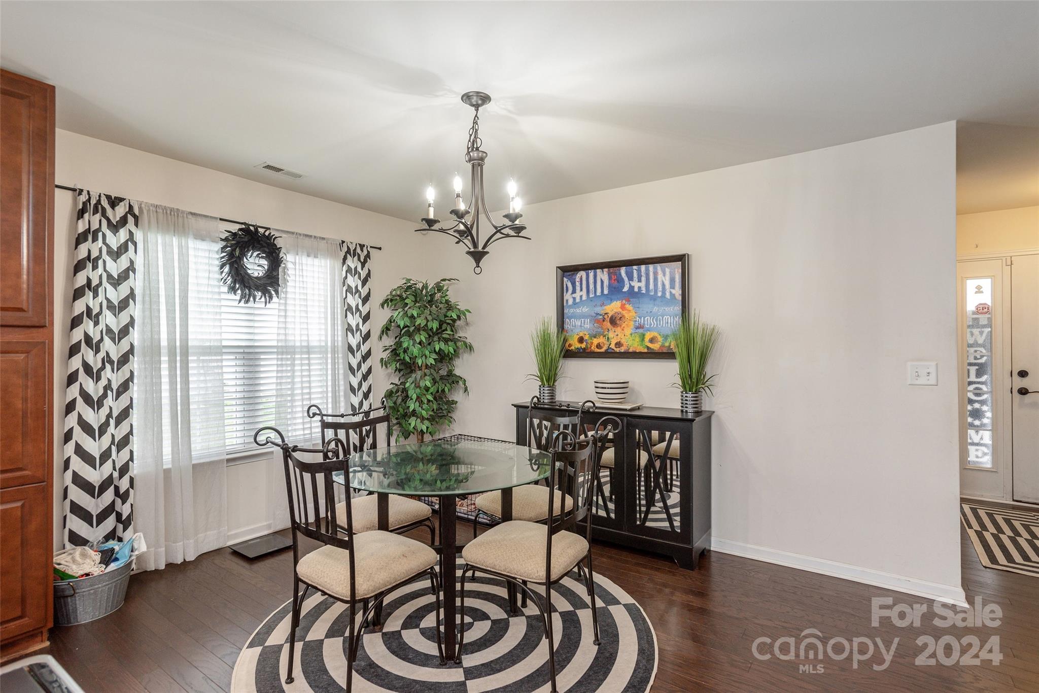 48 East Hiawassee Road Fletcher, NC 28732 - Photo 10 of 20 a view of a dining room with furniture and chandelier