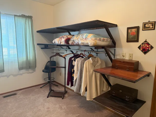 a room with furniture and mirror