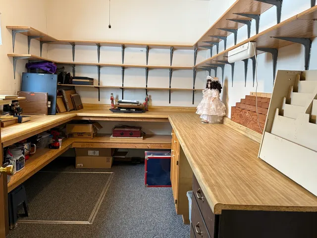 a kitchen with a sink a stove and cabinets