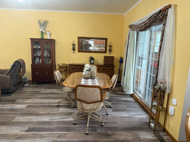 a dining room with furniture and window