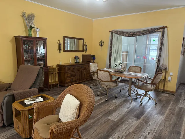 a work room with furniture and wooden floor
