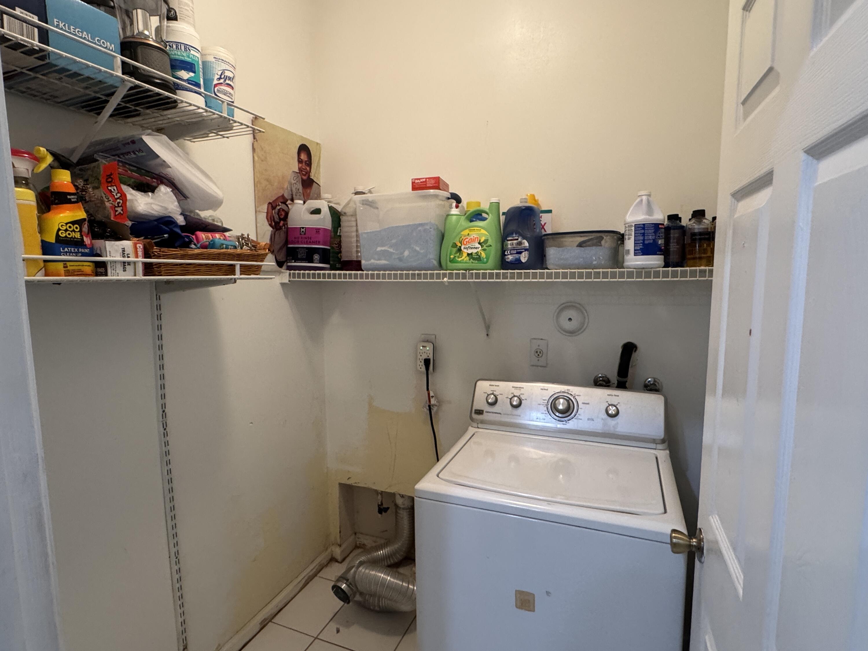 1011 Salmon Isle Greenacres, FL 33413 - Photo 22 of 28 a utility room with dryer and washer