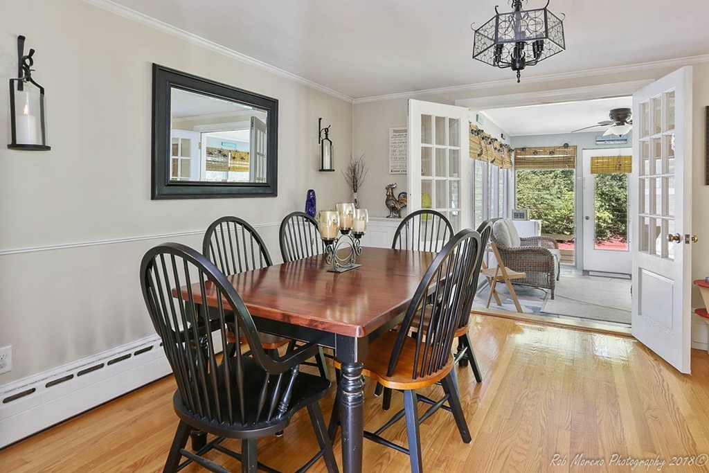 5 Cedarview Road Ipswich, MA 01938 - Photo 11 of 30 a dining room with furniture a chandelier and wooden floor