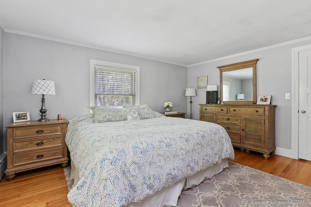 5 Cedarview Road Ipswich, MA 01938 - Photo 13 of 30 a spacious bedroom with a bed and a dresser