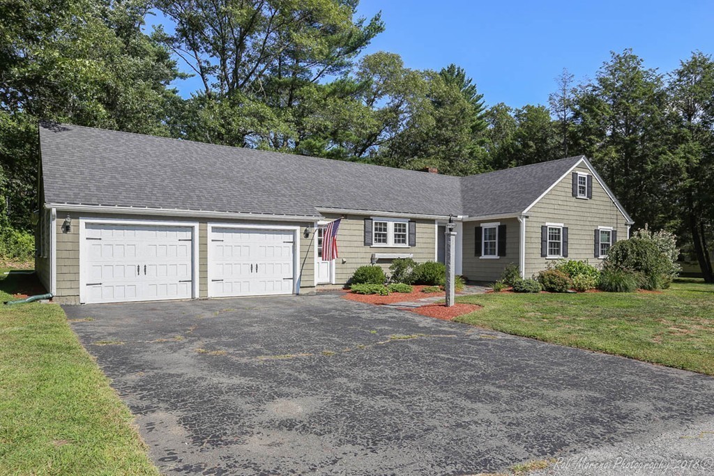 5 Cedarview Road Ipswich, MA 01938 - Photo 2 of 30 a front view of a house with a yard and garage