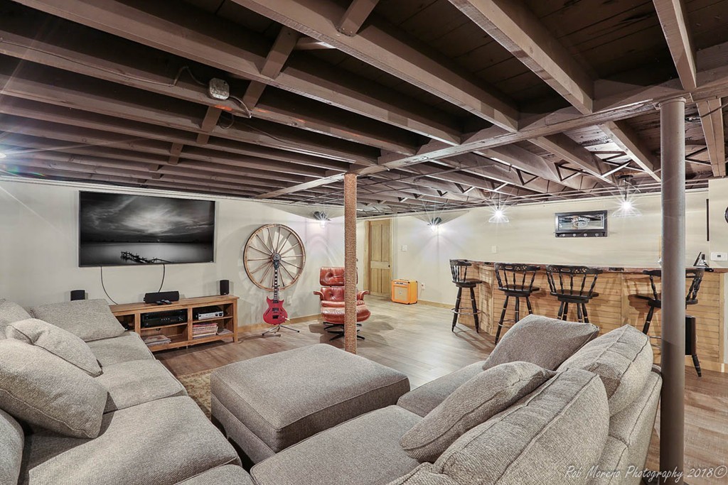 5 Cedarview Road Ipswich, MA 01938 - Photo 22 of 30 a living room with furniture a flat screen tv and a large window