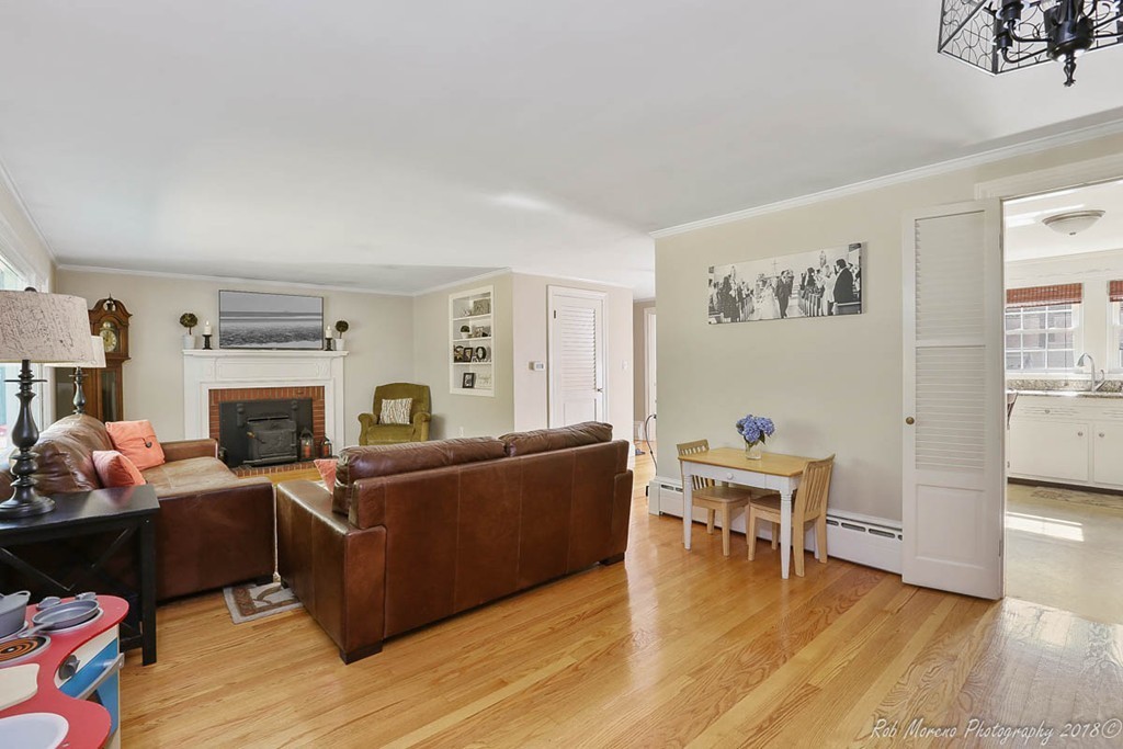 5 Cedarview Road Ipswich, MA 01938 - Photo 10 of 30 a living room with furniture wooden floor and a fireplace