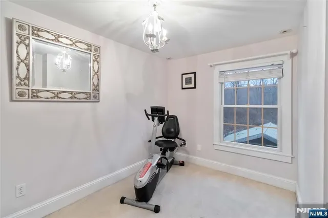 a room with gym equipment and a window