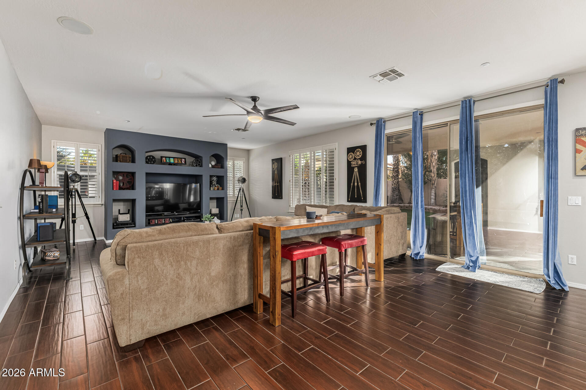 6829 West Briles Road Peoria, AZ 85383 - Photo 20 of 61 a living room with furniture and wooden floor