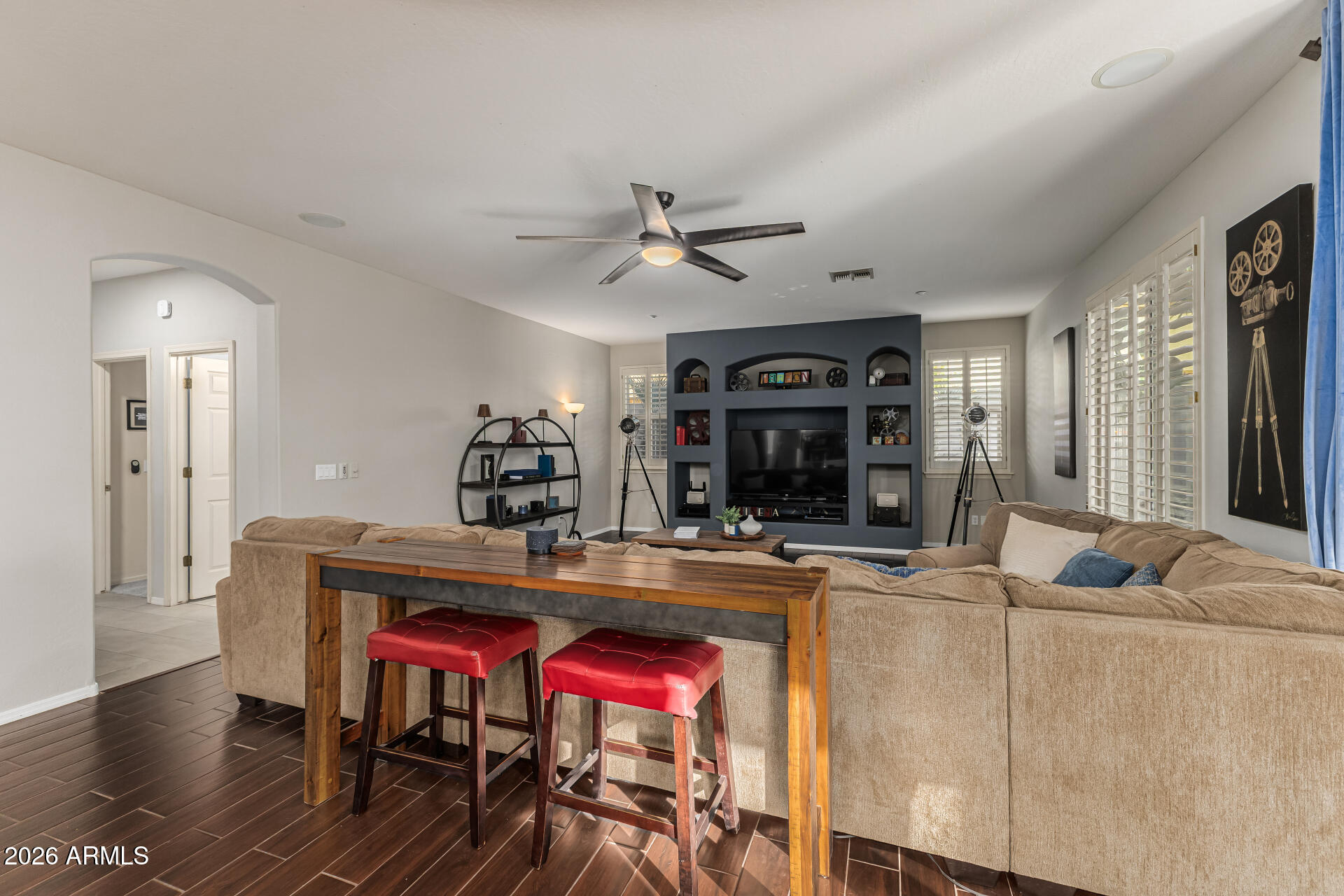 6829 West Briles Road Peoria, AZ 85383 - Photo 21 of 61 a living room with furniture and a table