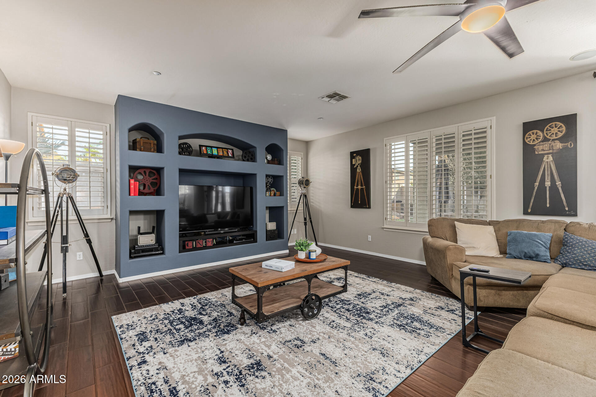 6829 West Briles Road Peoria, AZ 85383 - Photo 22 of 61 a living room with furniture and a rug
