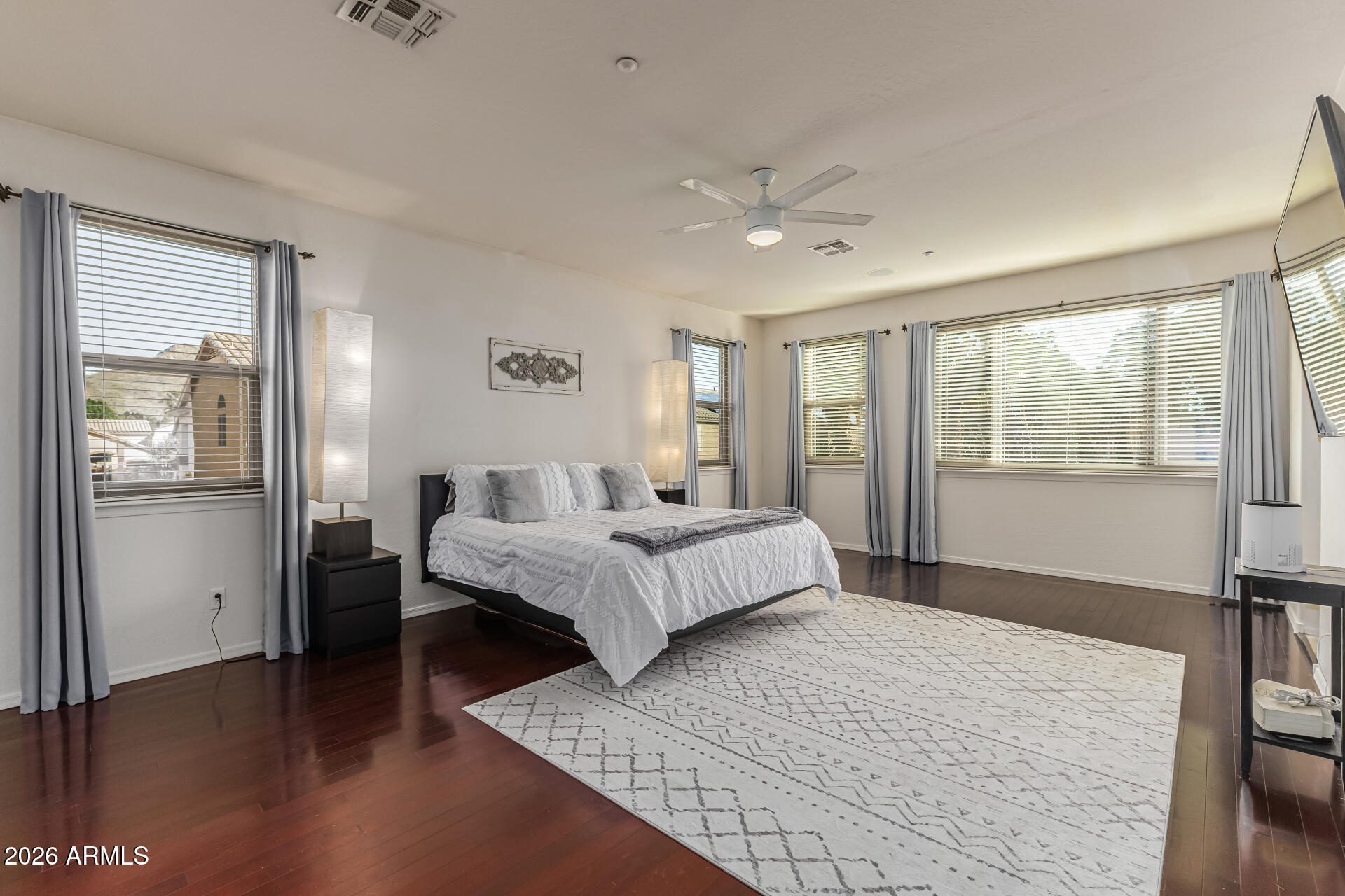 6829 West Briles Road Peoria, AZ 85383 - Photo 26 of 61 a bedroom with a large bed and a window