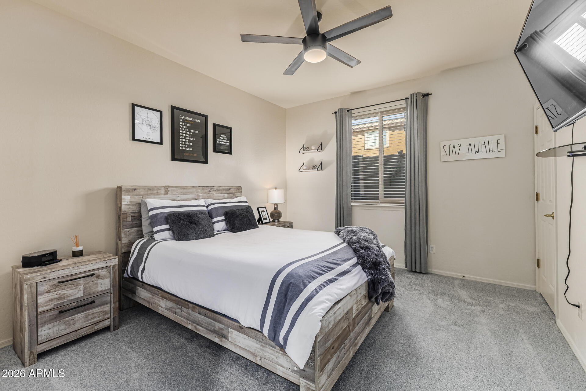 6829 West Briles Road Peoria, AZ 85383 - Photo 30 of 61 a bedroom with a bed and a window