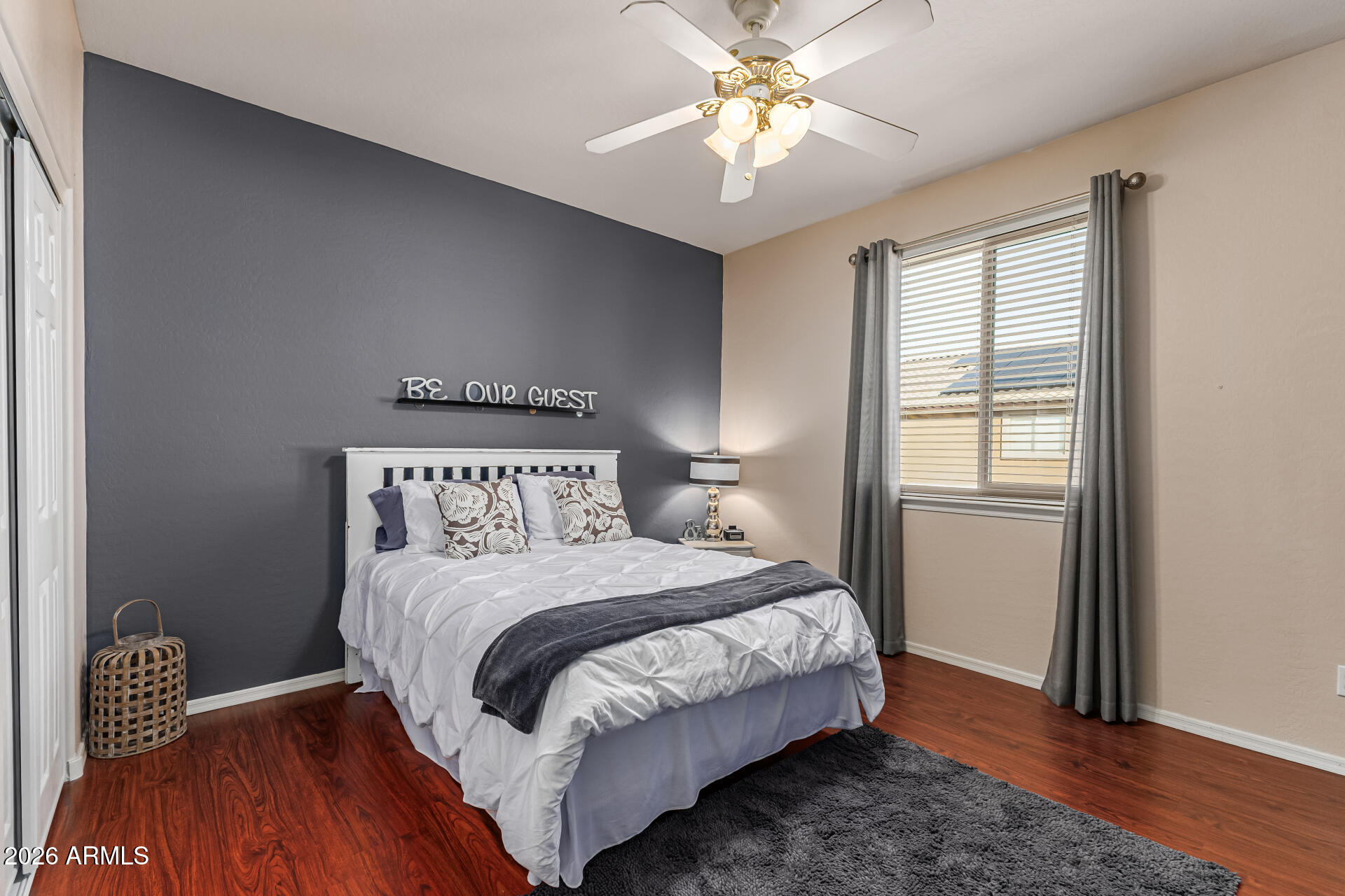 6829 West Briles Road Peoria, AZ 85383 - Photo 32 of 61 a bedroom with a bed and a window