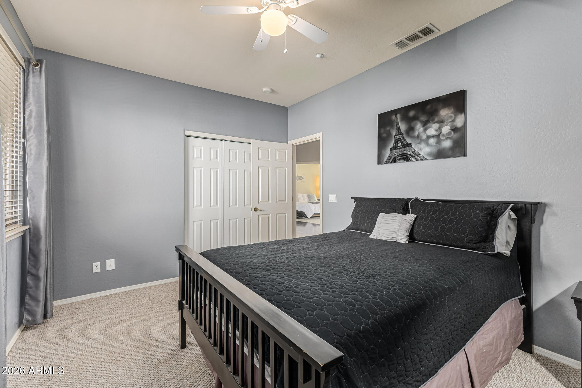 6829 West Briles Road Peoria, AZ 85383 - Photo 33 of 61 a bedroom with a bed and a chandelier