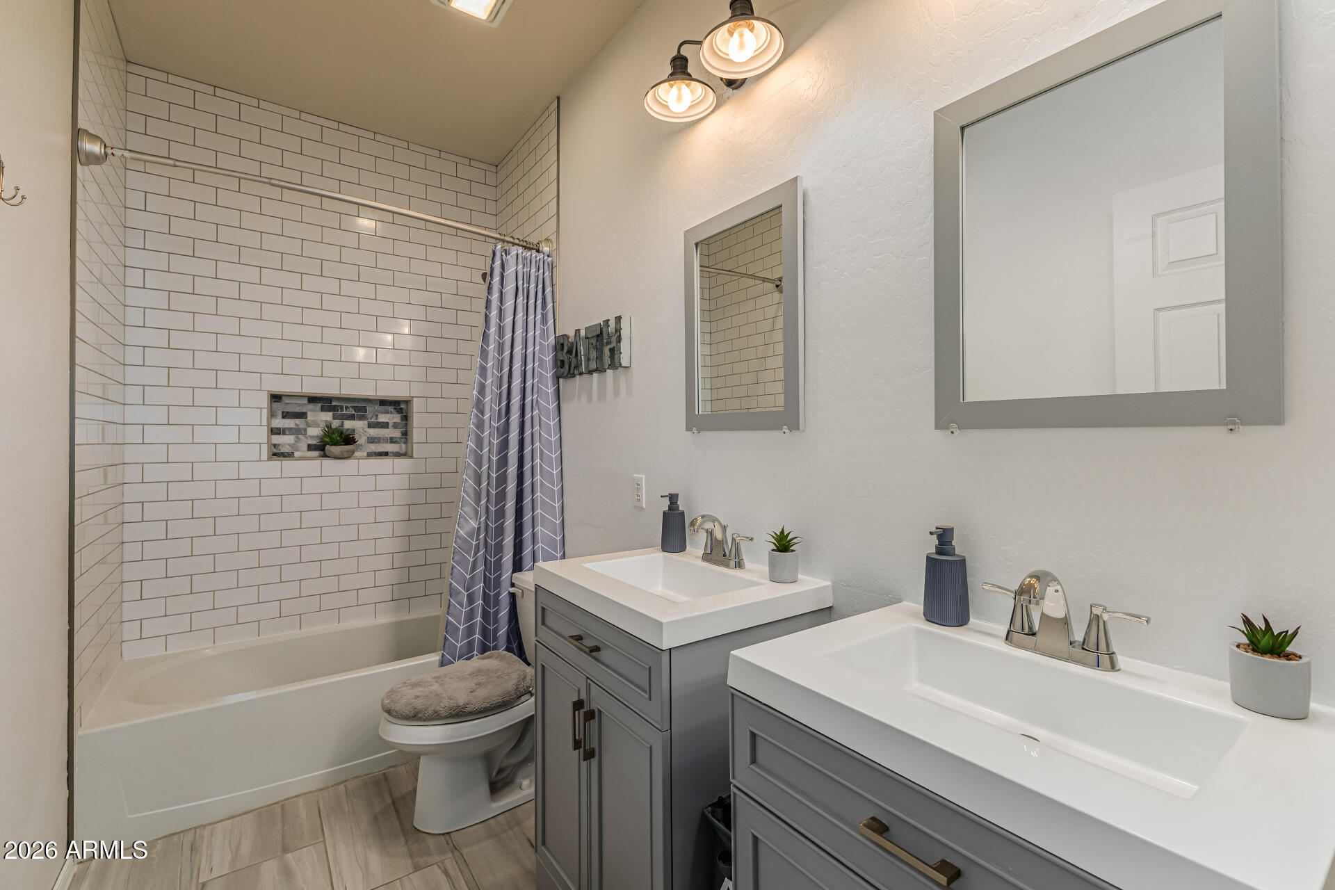 6829 West Briles Road Peoria, AZ 85383 - Photo 34 of 61 a bathroom with a sink toilet and shower