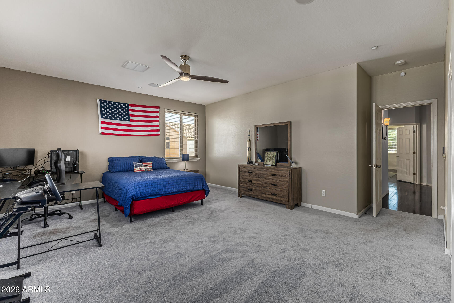 6829 West Briles Road Peoria, AZ 85383 - Photo 36 of 61 a living room with furniture and a flat screen tv