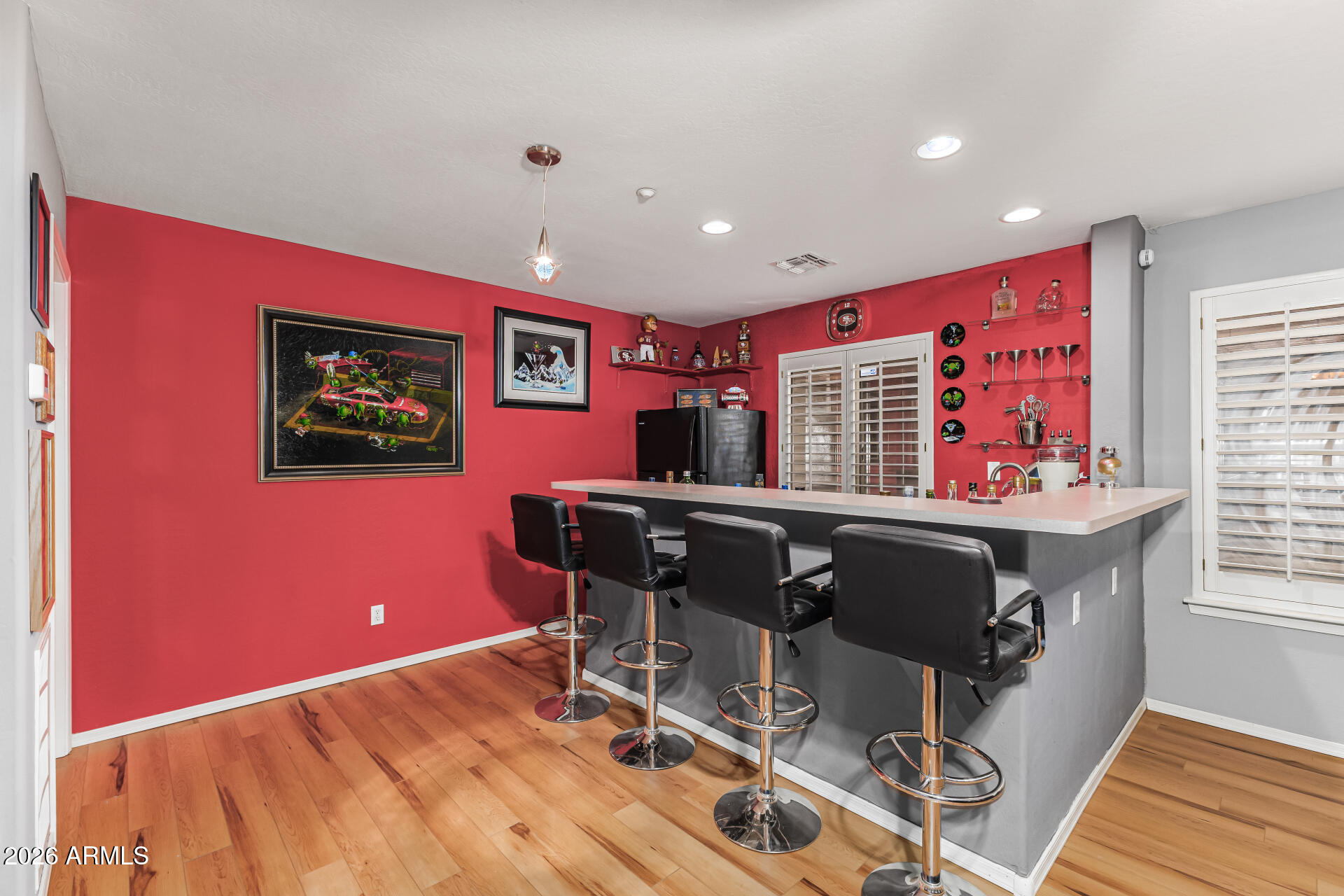 6829 West Briles Road Peoria, AZ 85383 - Photo 38 of 61 a dining room with a table and chairs