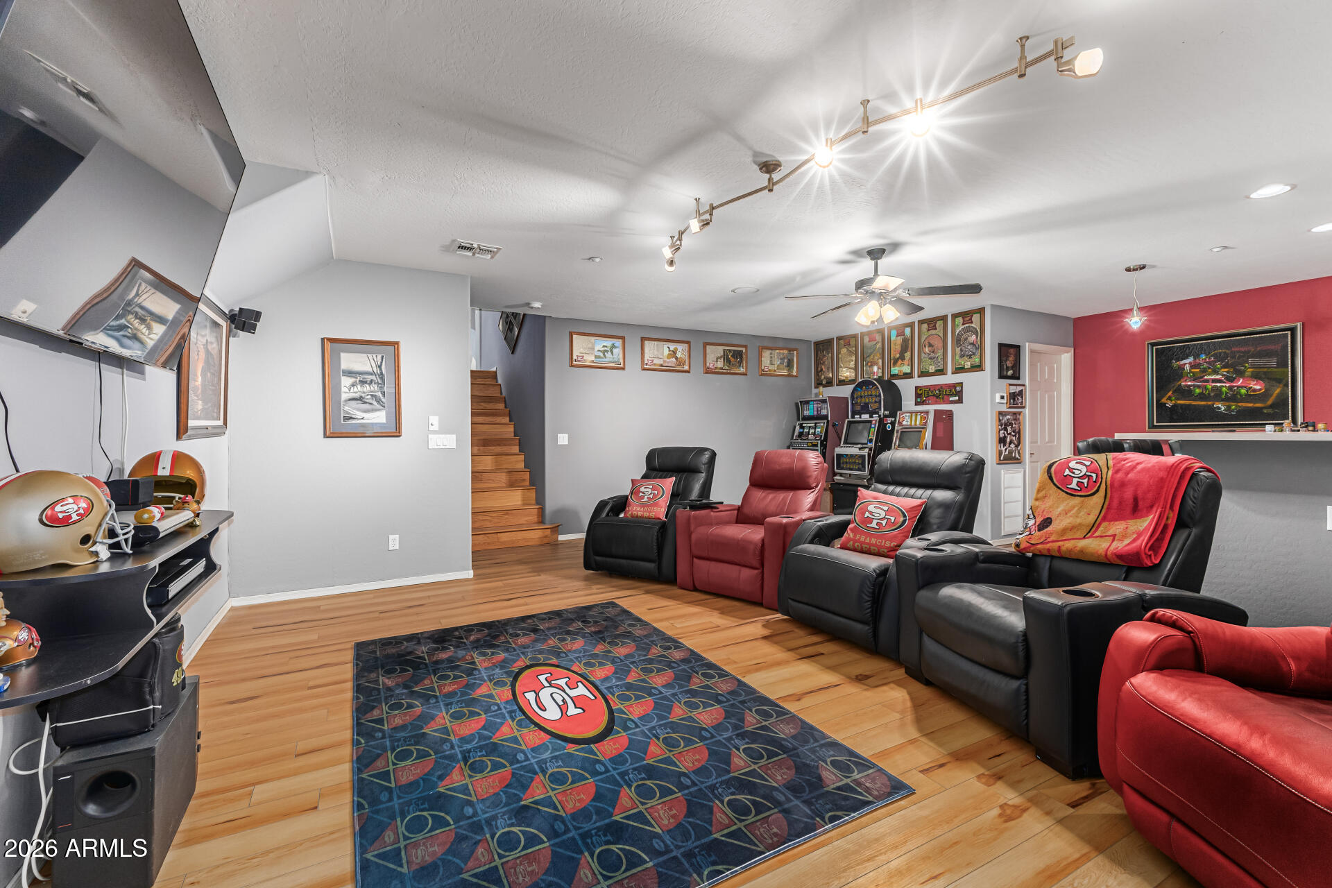 6829 West Briles Road Peoria, AZ 85383 - Photo 39 of 61 a living room with furniture a rug and a chandelier