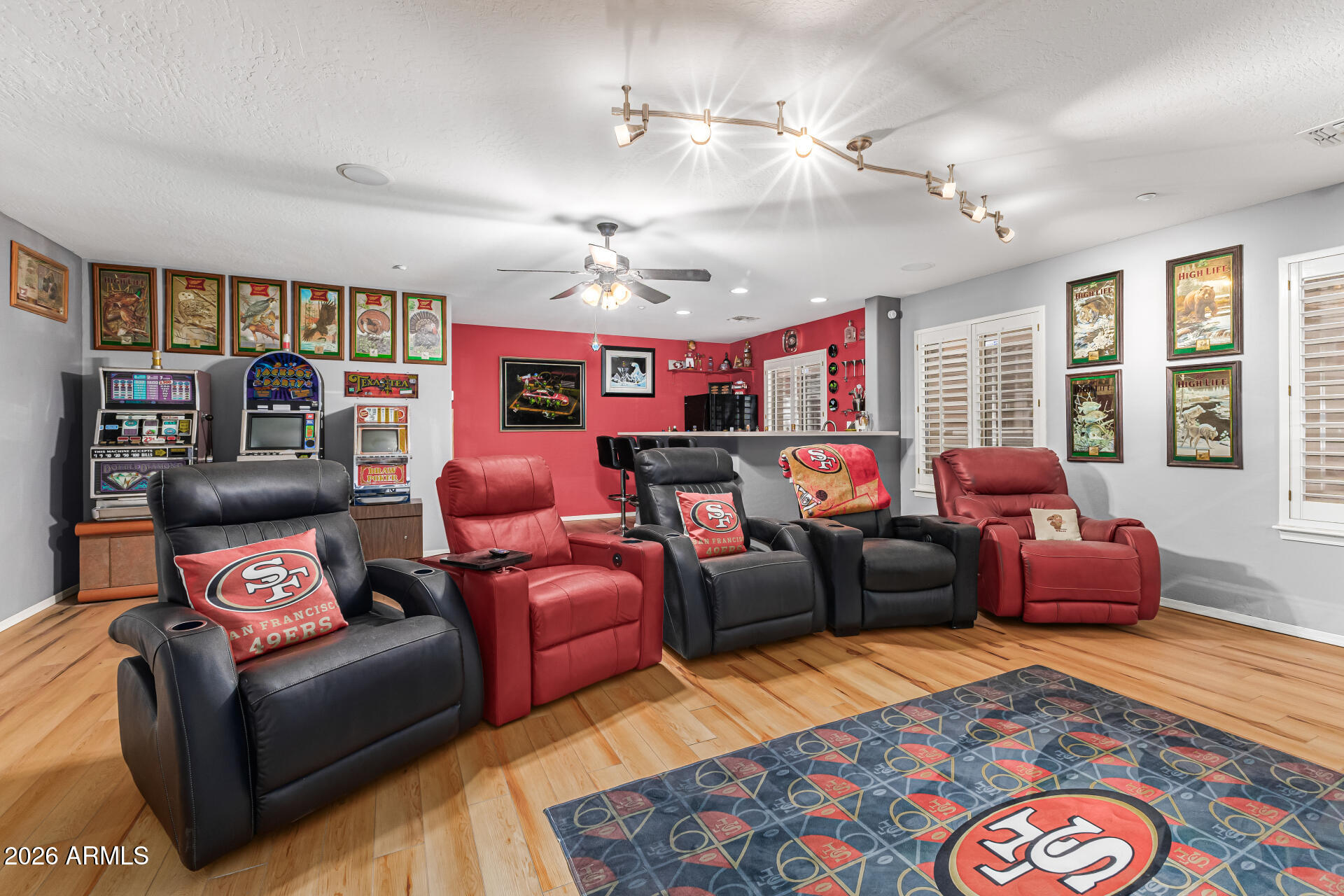 6829 West Briles Road Peoria, AZ 85383 - Photo 40 of 61 a living room with furniture a rug and a chandelier