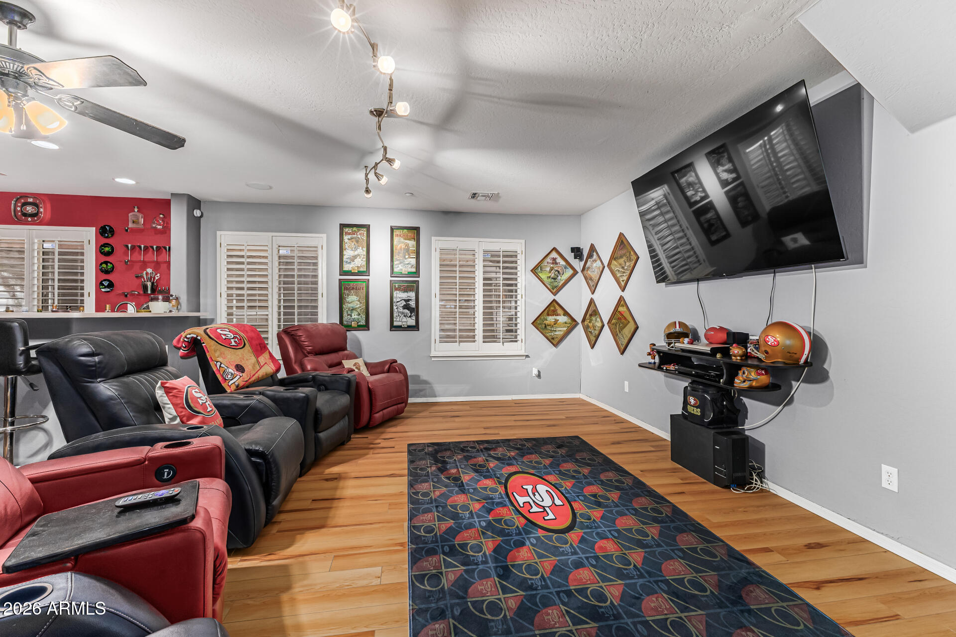 6829 West Briles Road Peoria, AZ 85383 - Photo 41 of 61 a living room with furniture and a flat screen tv