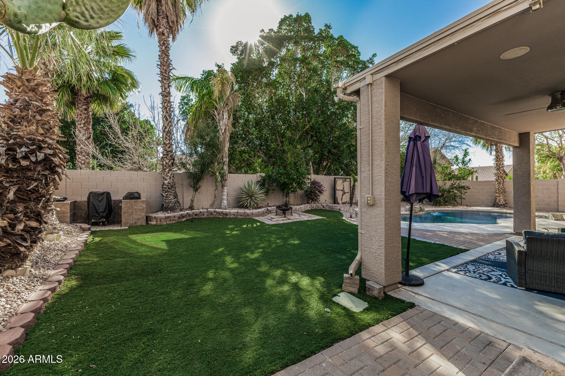 6829 West Briles Road Peoria, AZ 85383 - Photo 44 of 61 a view of backyard with swimming pool and furniture