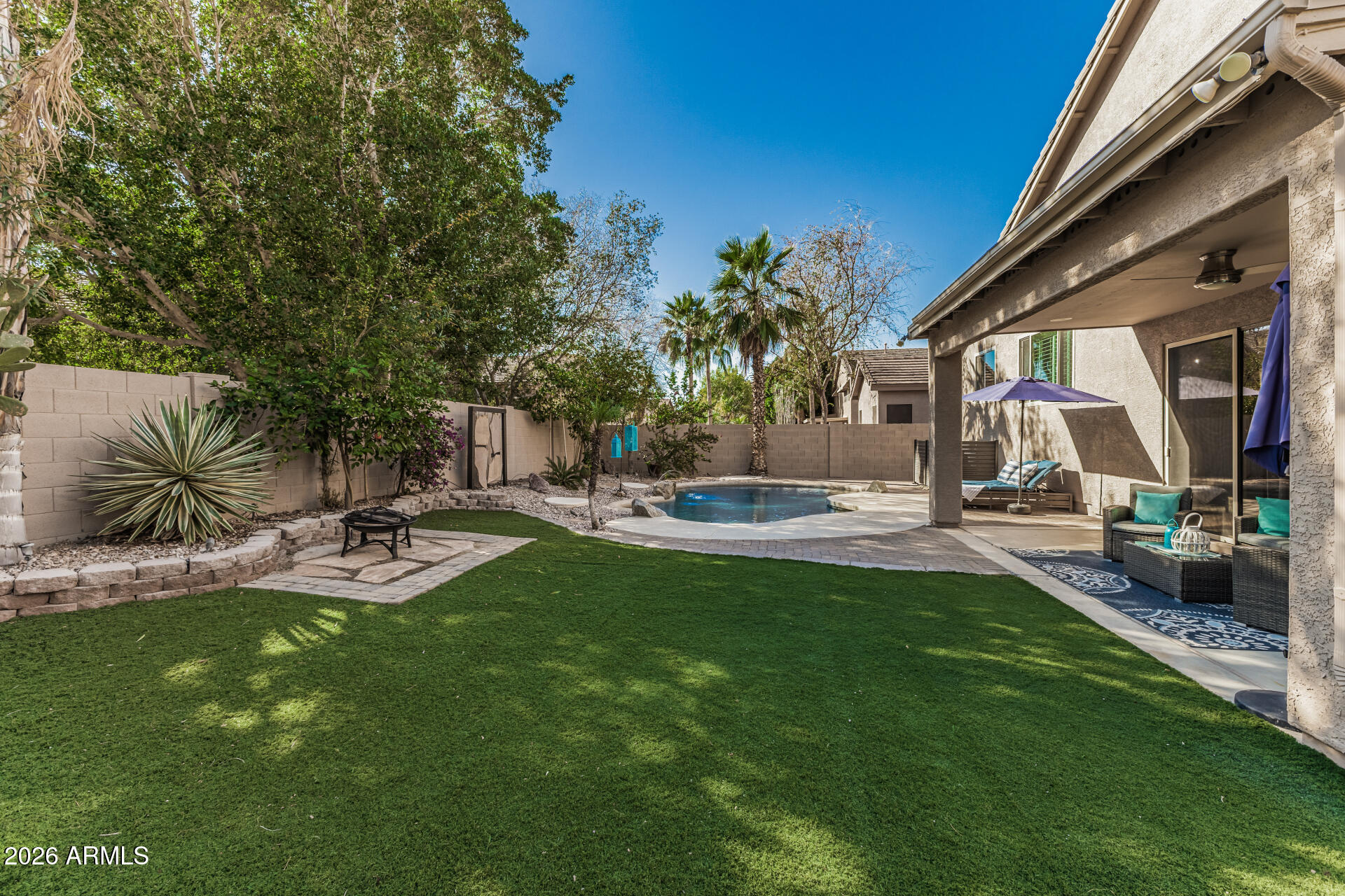 6829 West Briles Road Peoria, AZ 85383 - Photo 45 of 61 a view of a backyard with sitting area