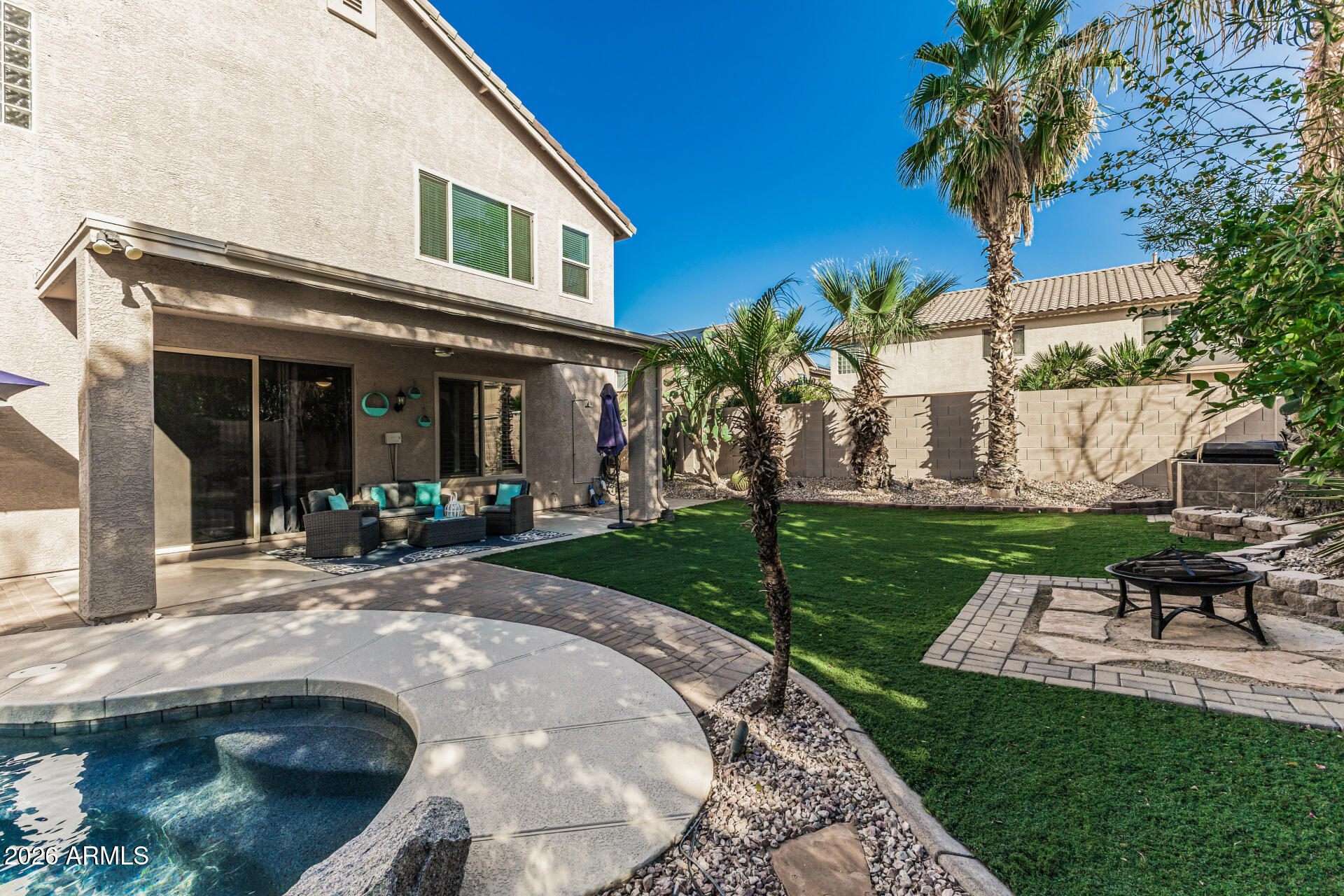 6829 West Briles Road Peoria, AZ 85383 - Photo 46 of 61 a view of a house with backyard porch and sitting area