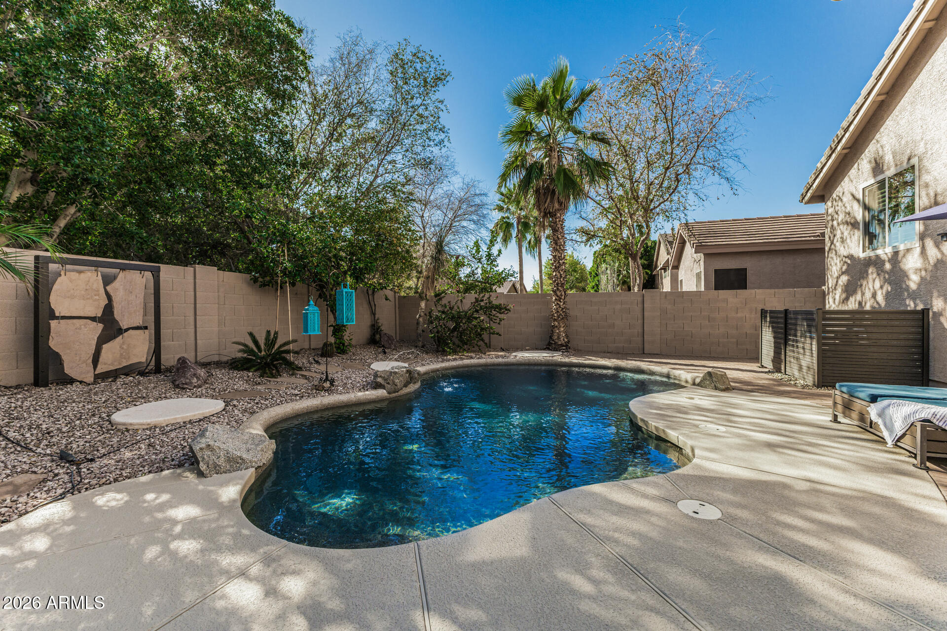 6829 West Briles Road Peoria, AZ 85383 - Photo 49 of 61 a view of a swimming pool with a patio
