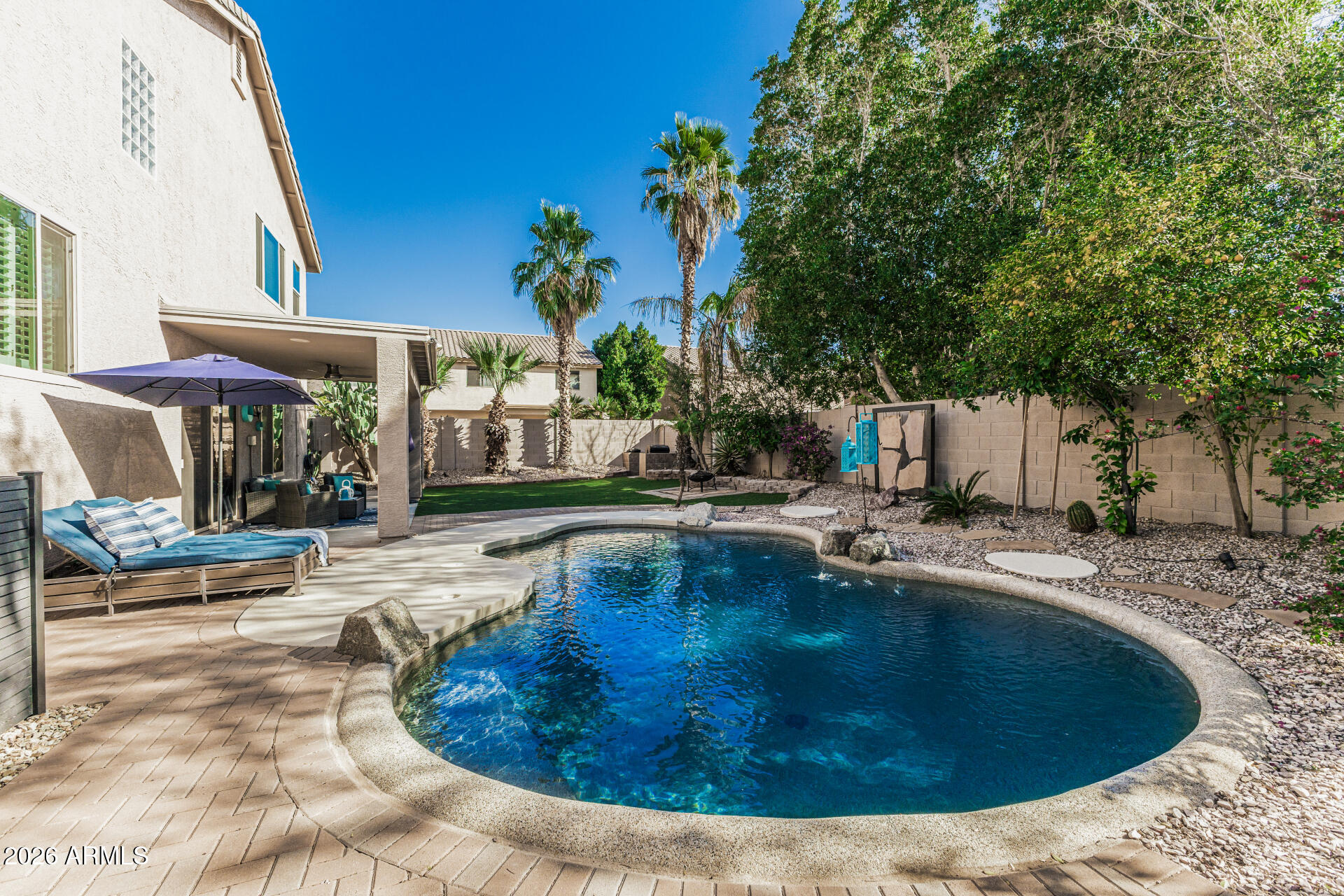 6829 West Briles Road Peoria, AZ 85383 - Photo 50 of 61 a view of a swimming pool with a patio