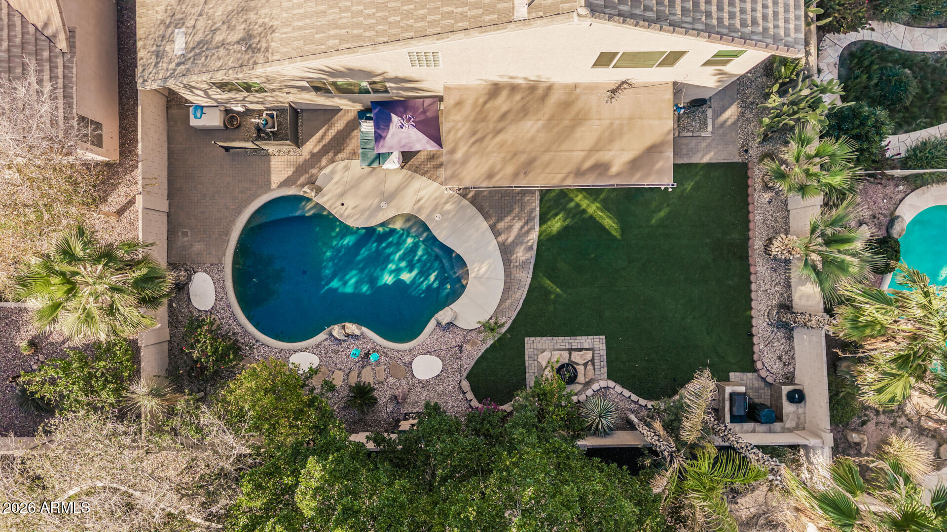 6829 West Briles Road Peoria, AZ 85383 - Photo 56 of 61 an aerial view of a house with a swimming pool