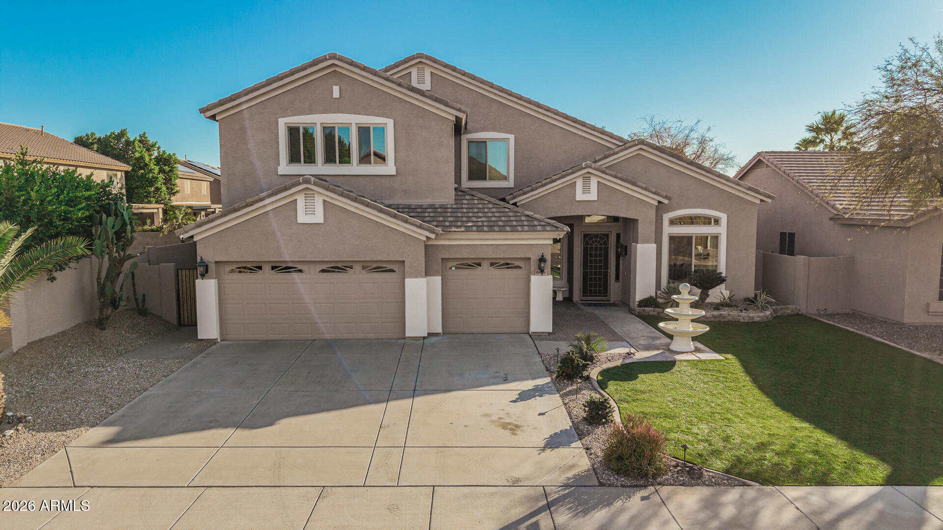 6829 West Briles Road Peoria, AZ 85383 - Photo 57 of 61 a front view of a house with garden