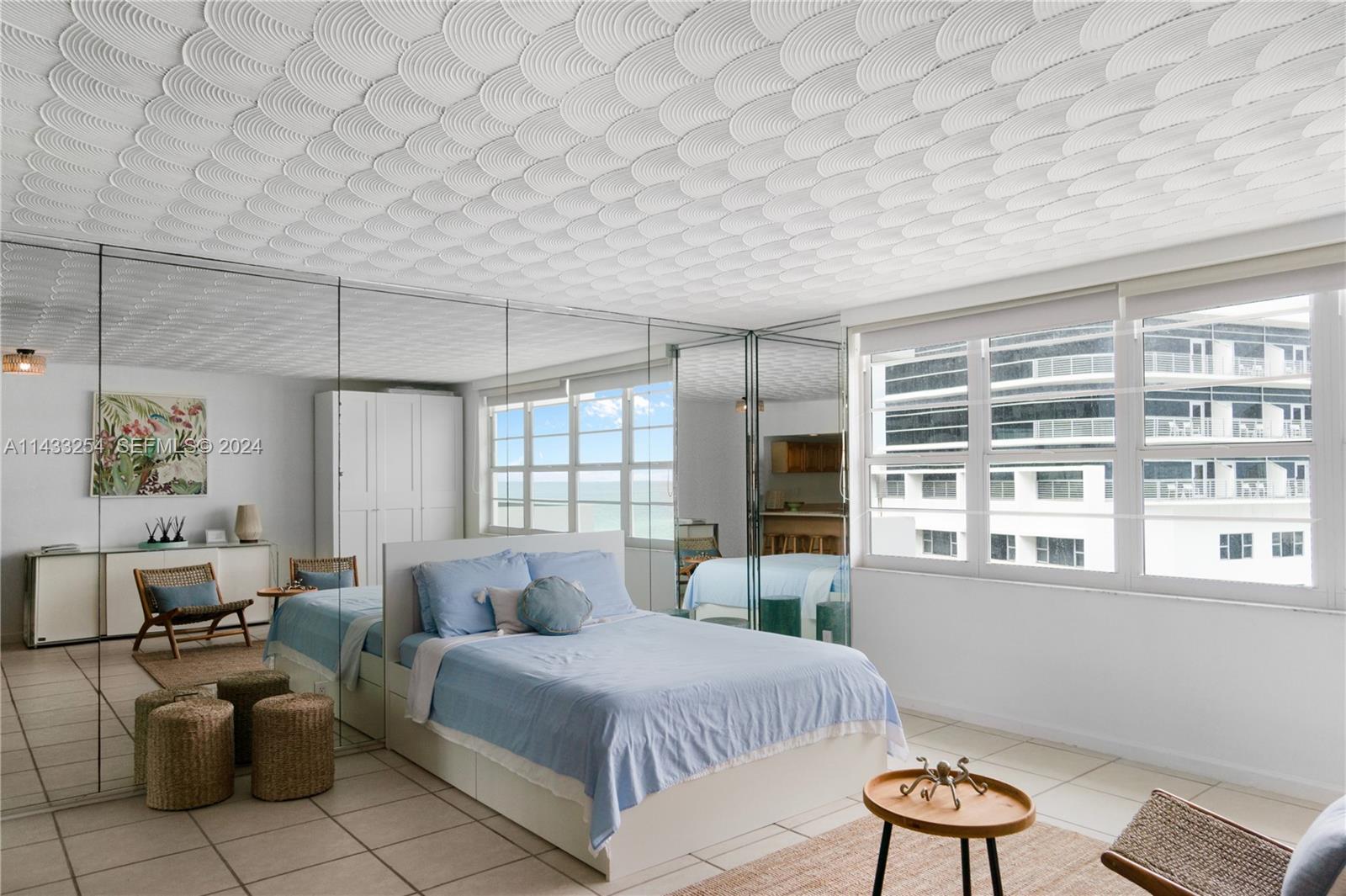 100 Lincoln Road, Unit 1039 Miami Beach, FL 33139 - Photo 11 of 26 a spacious bedroom with a bed and a couch