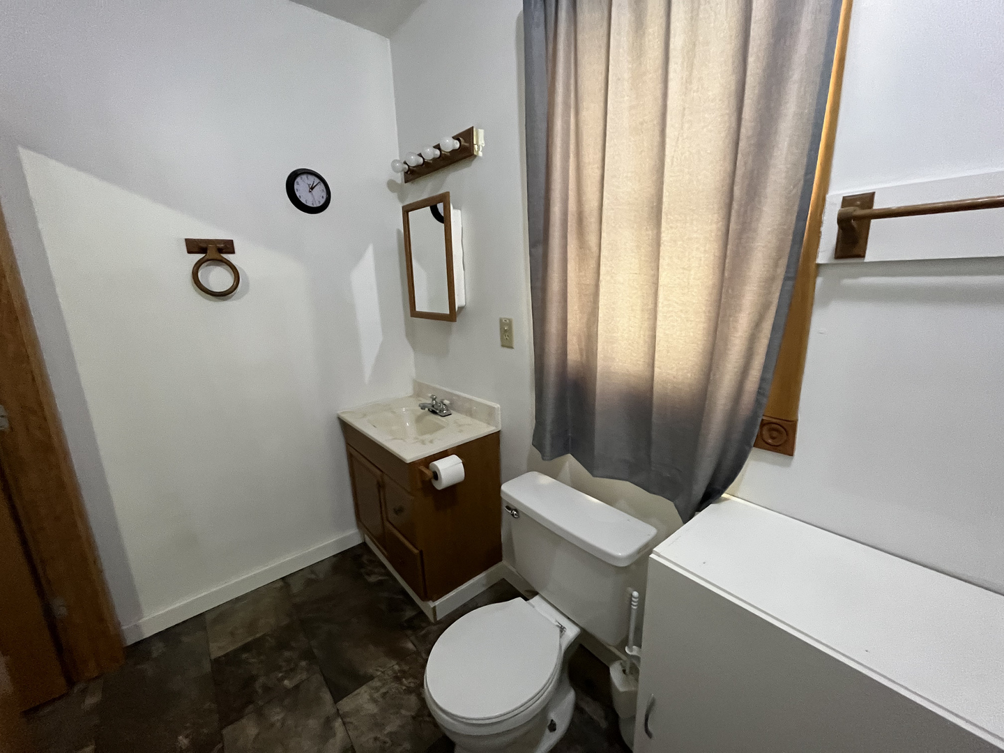 3420 Howlett Road Paw Paw, IL 61353 - Photo 18 of 34 a white toilet sitting next to a bathroom sink