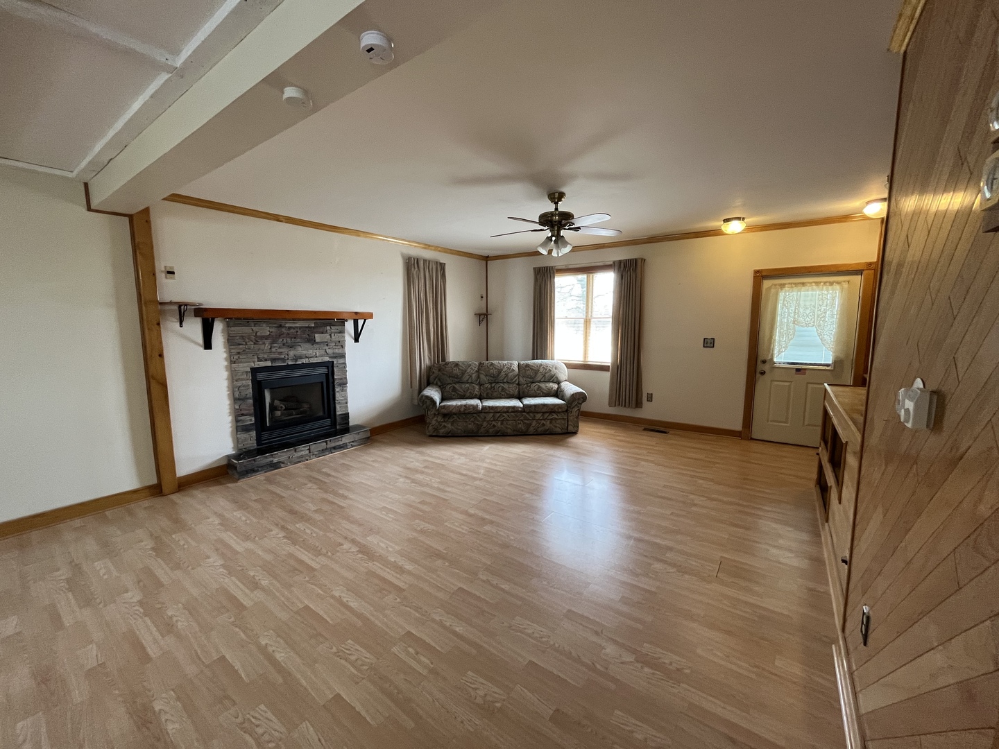 3420 Howlett Road Paw Paw, IL 61353 - Photo 4 of 34 a view of a livingroom with furniture a fireplace
