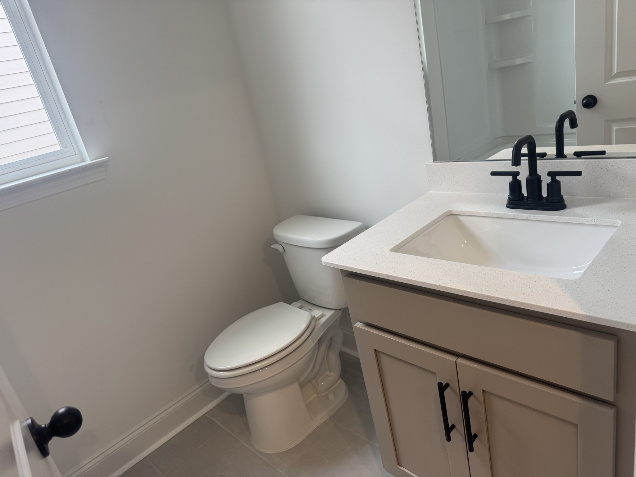 235 Limestone Way Mount Juliet, TN 37122 - Photo 22 of 45 a bathroom with a sink a toilet and a window