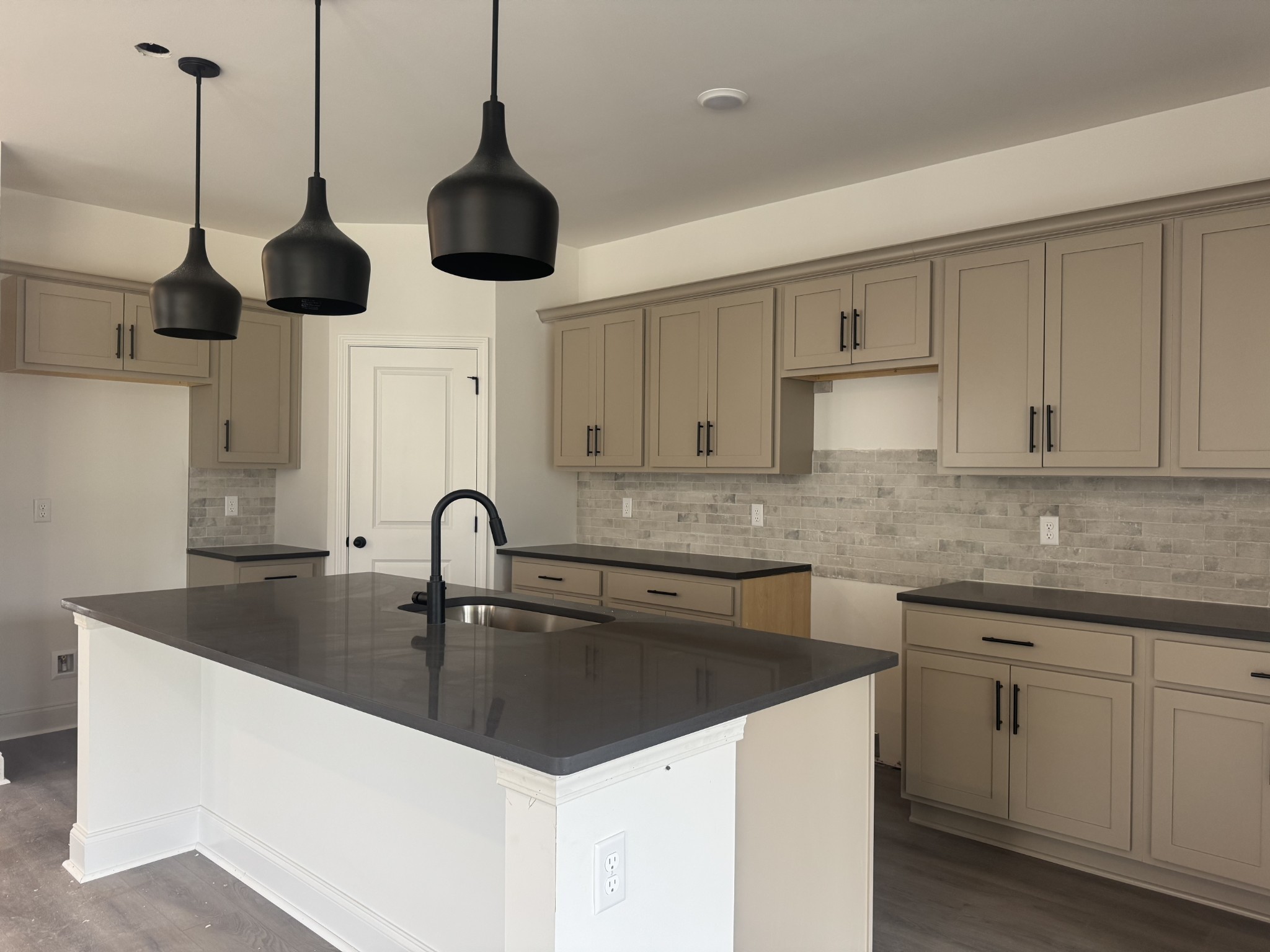 235 Limestone Way Mount Juliet, TN 37122 - Photo 26 of 45 a kitchen with stainless steel appliances granite countertop a sink a stove a counter space and cabinets