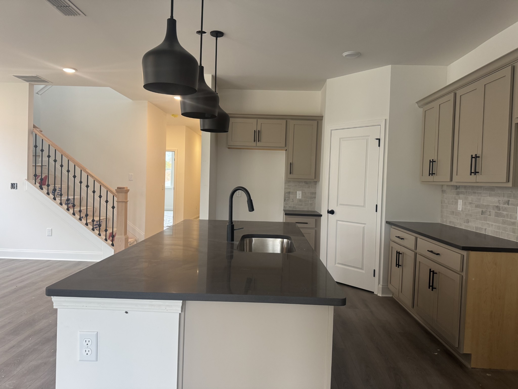 235 Limestone Way Mount Juliet, TN 37122 - Photo 27 of 45 a kitchen with stainless steel appliances granite countertop a sink a stove and refrigerator