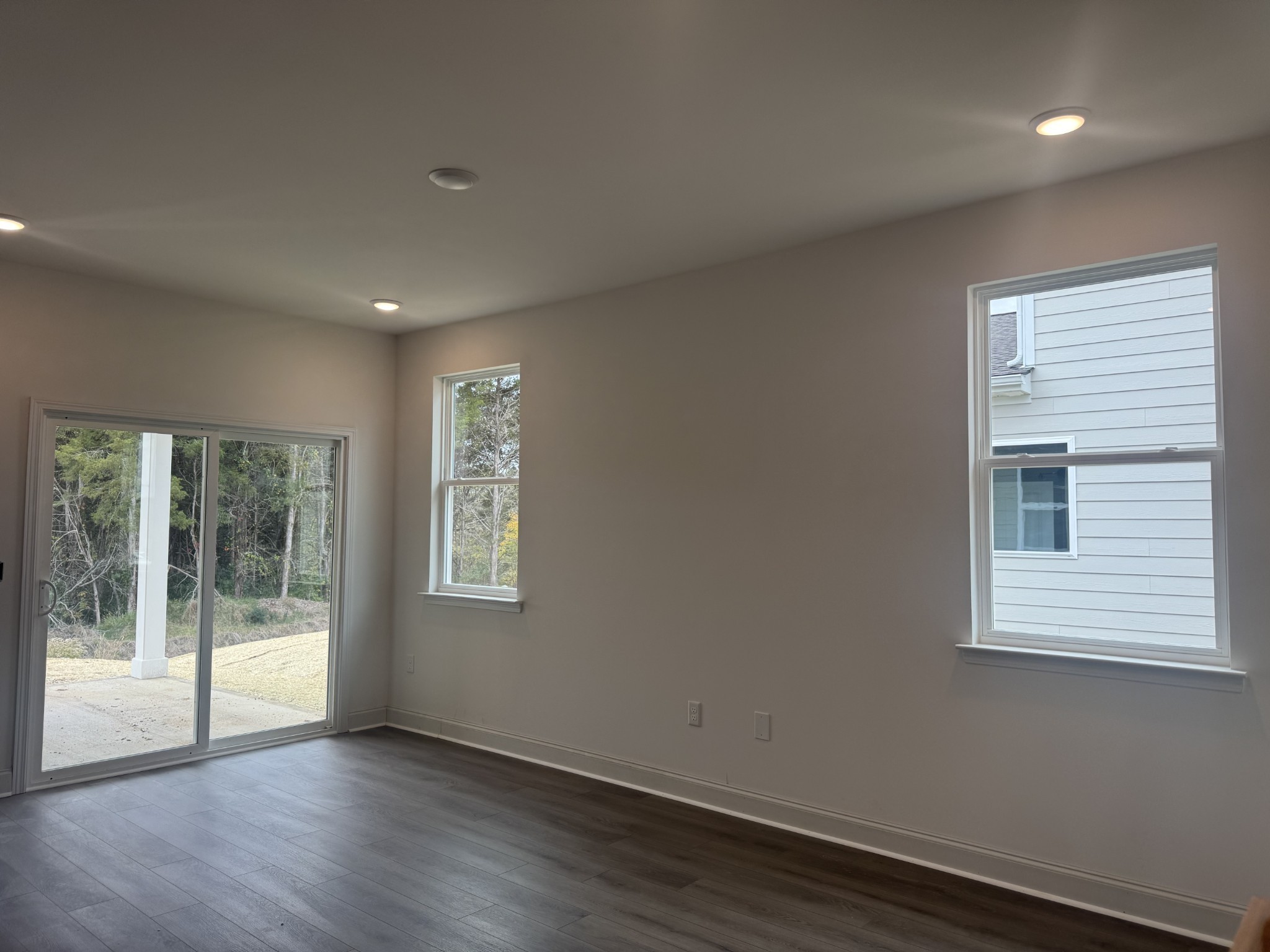235 Limestone Way Mount Juliet, TN 37122 - Photo 32 of 45 a view of an empty room with wooden floor and a window