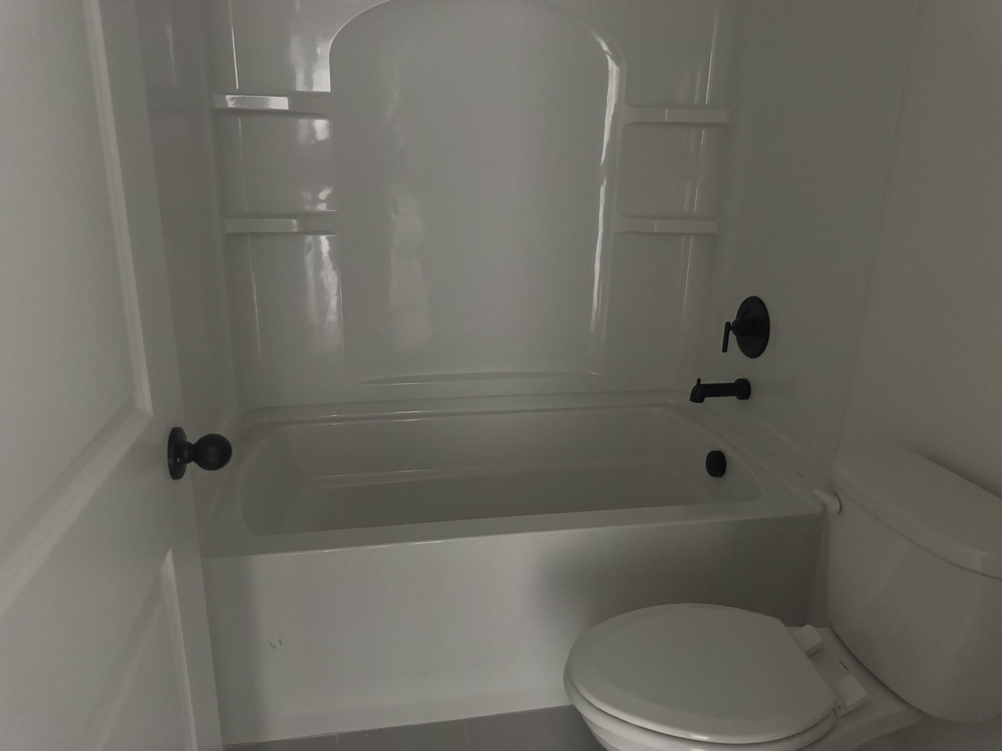 235 Limestone Way Mount Juliet, TN 37122 - Photo 5 of 45 a bathroom with a toilet and shower