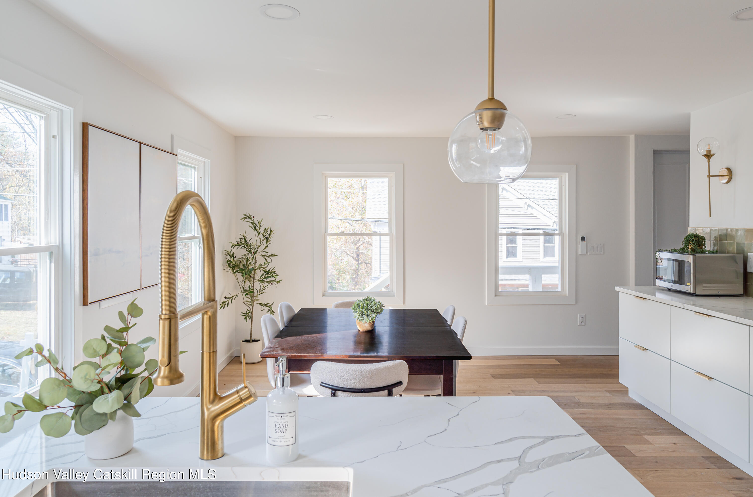 9 Mountain Road Rosendale, NY 12472 - Photo 12 of 46 a living room with furniture a chandelier and a window