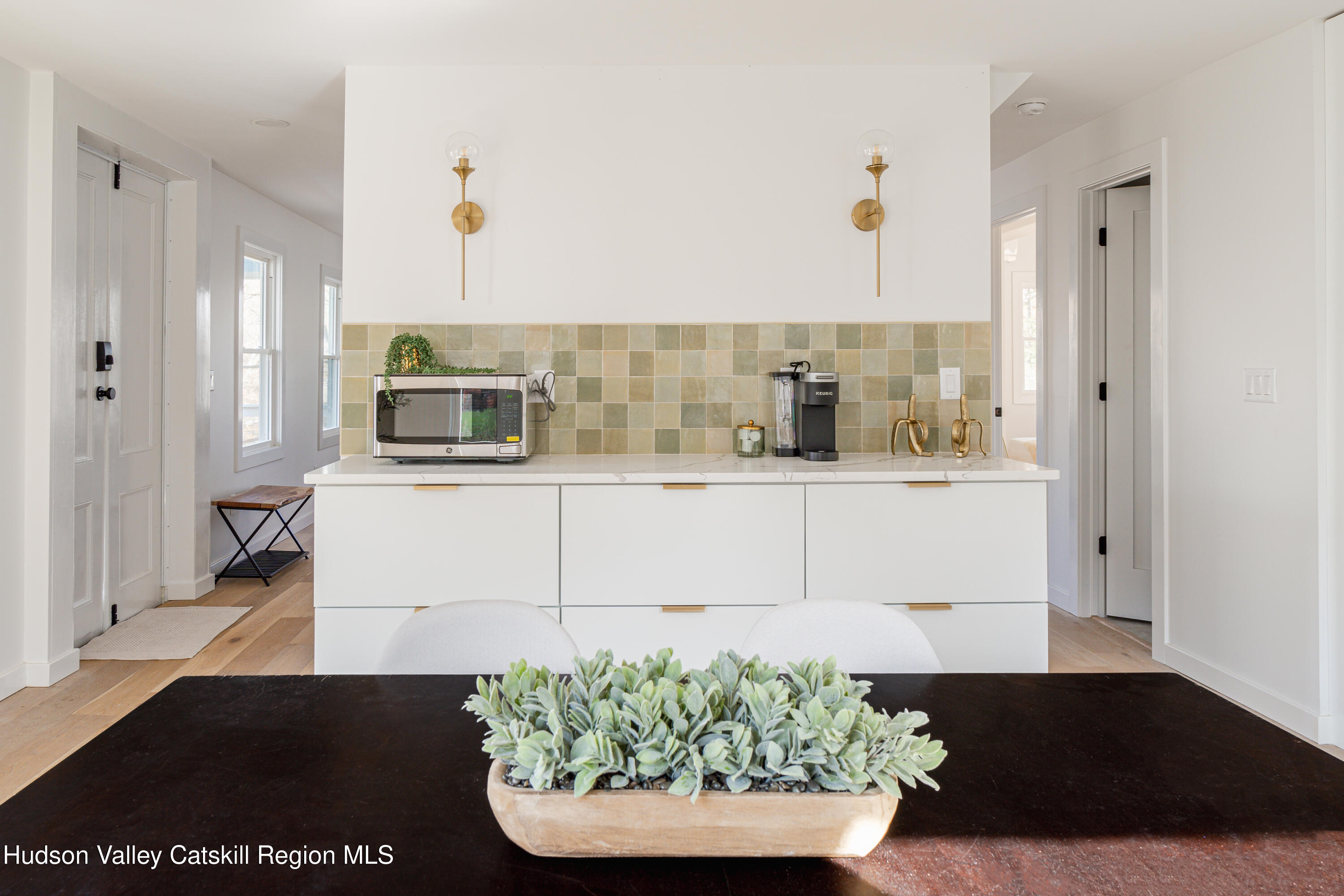 9 Mountain Road Rosendale, NY 12472 - Photo 8 of 46 a living room with a couch and a potted plant