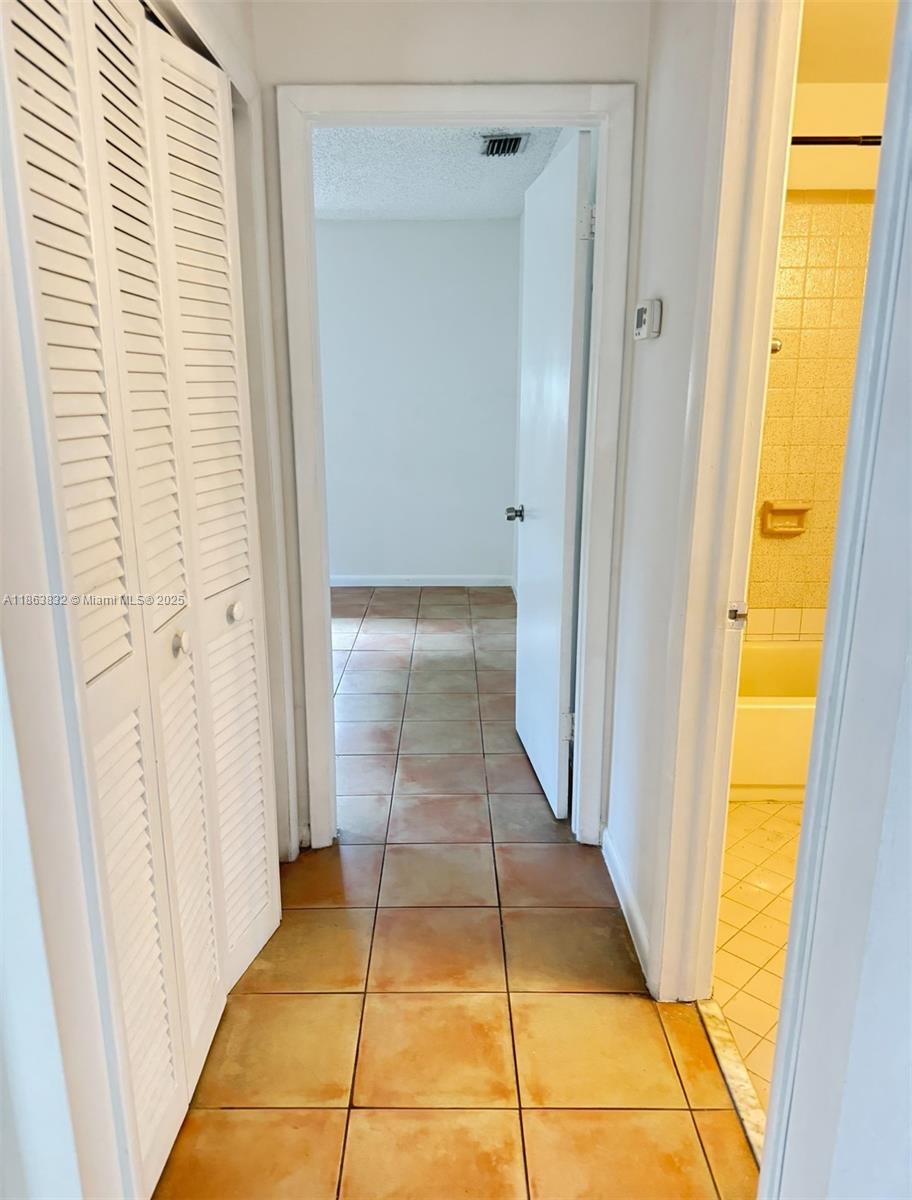1327 Riverside Circle, Unit 1327 Wellington, FL 33414 - Photo 5 of 20 a view of a hallway