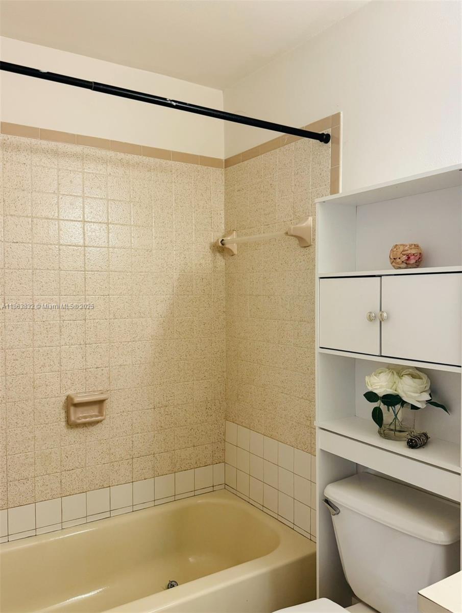 1327 Riverside Circle, Unit 1327 Wellington, FL 33414 - Photo 10 of 20 a bathroom with a shower and a toilet