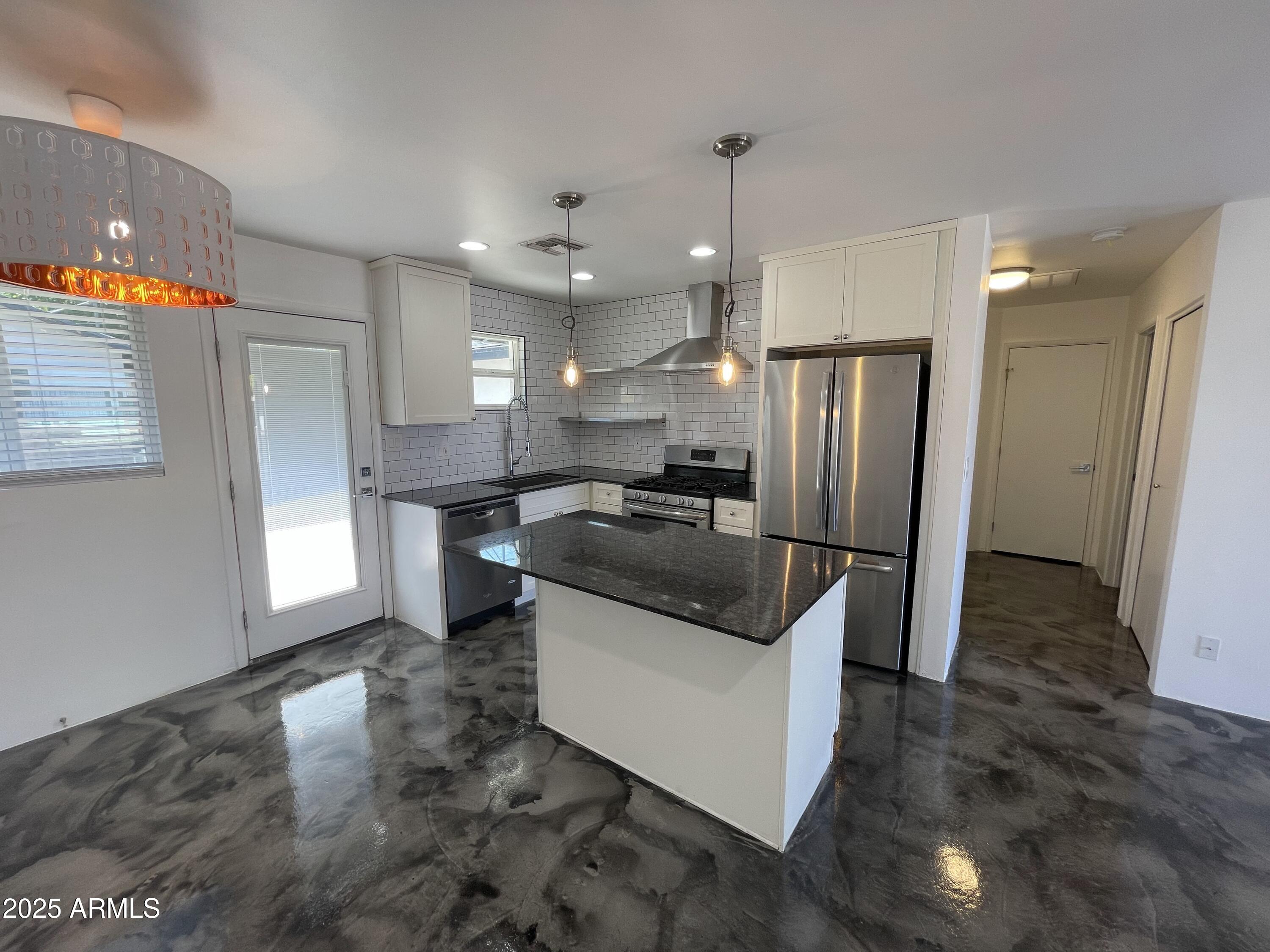 3416 North 37th Street, Unit 3 Phoenix, AZ 85018 - Photo 1 of 22 a kitchen with stainless steel appliances granite countertop a sink a stove a refrigerator and a oven