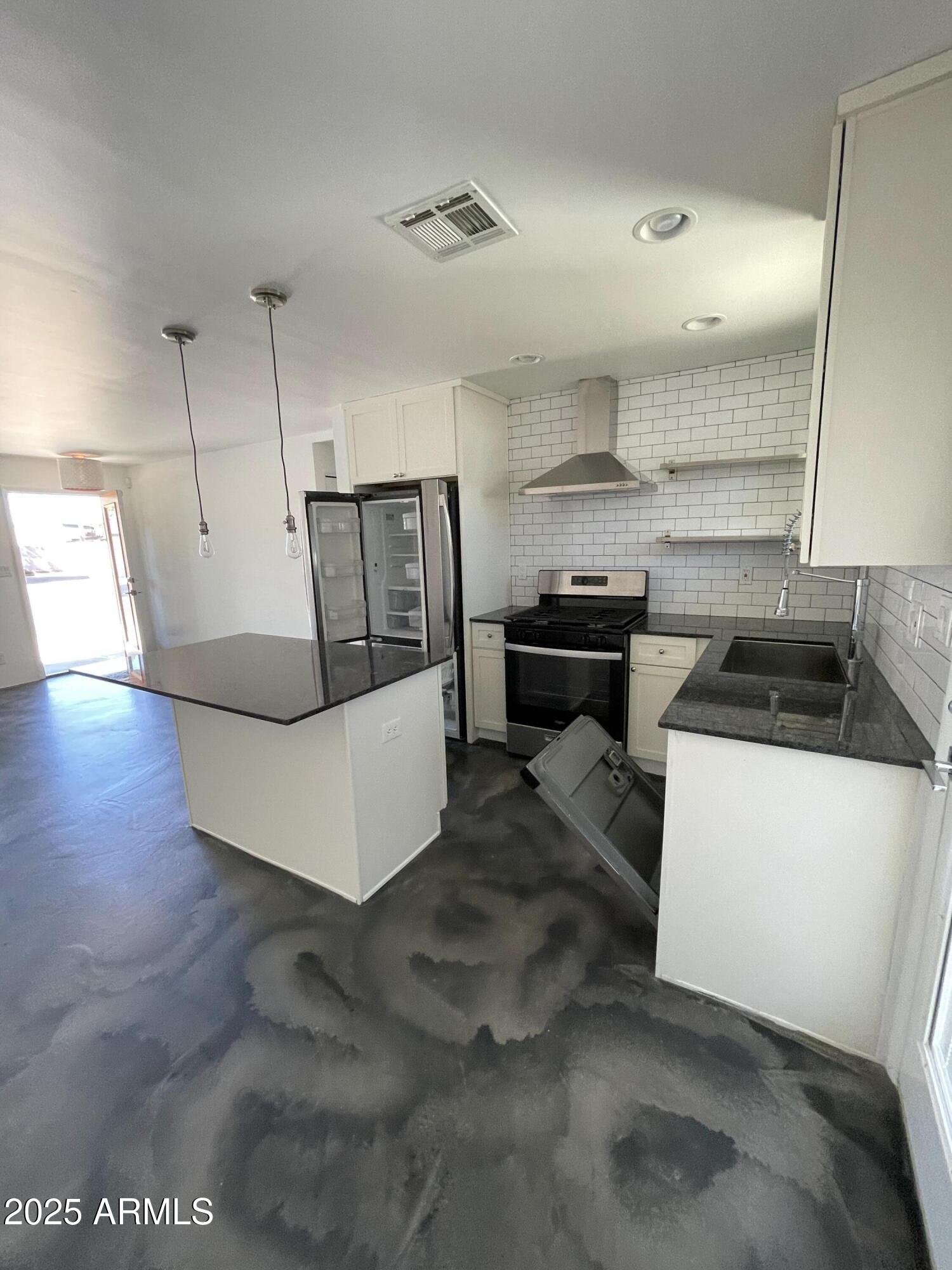 3416 North 37th Street, Unit 3 Phoenix, AZ 85018 - Photo 16 of 22 a living room with furniture and a flat screen tv