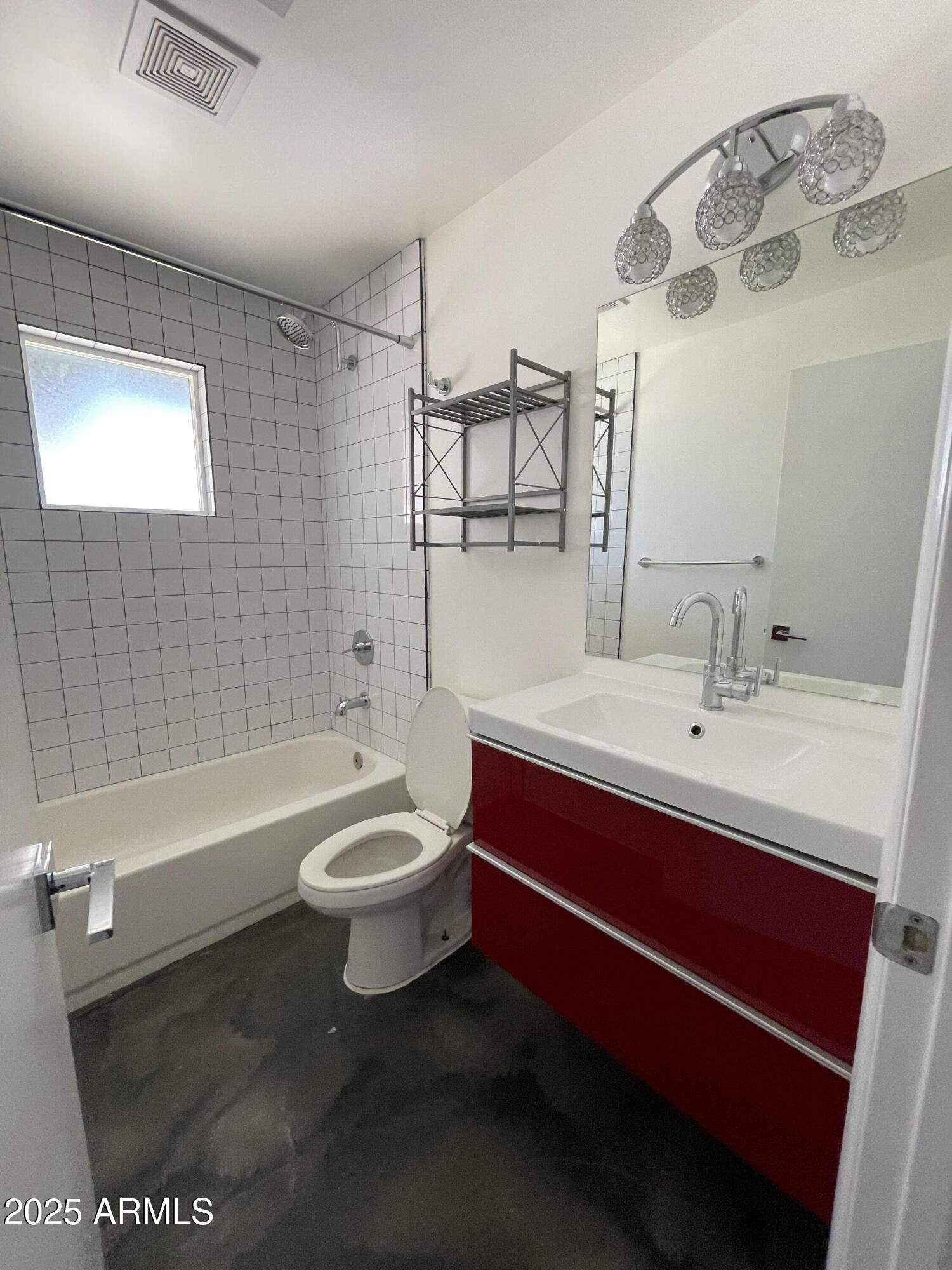 3416 North 37th Street, Unit 3 Phoenix, AZ 85018 - Photo 17 of 22 a bathroom with a sink a toilet and shower