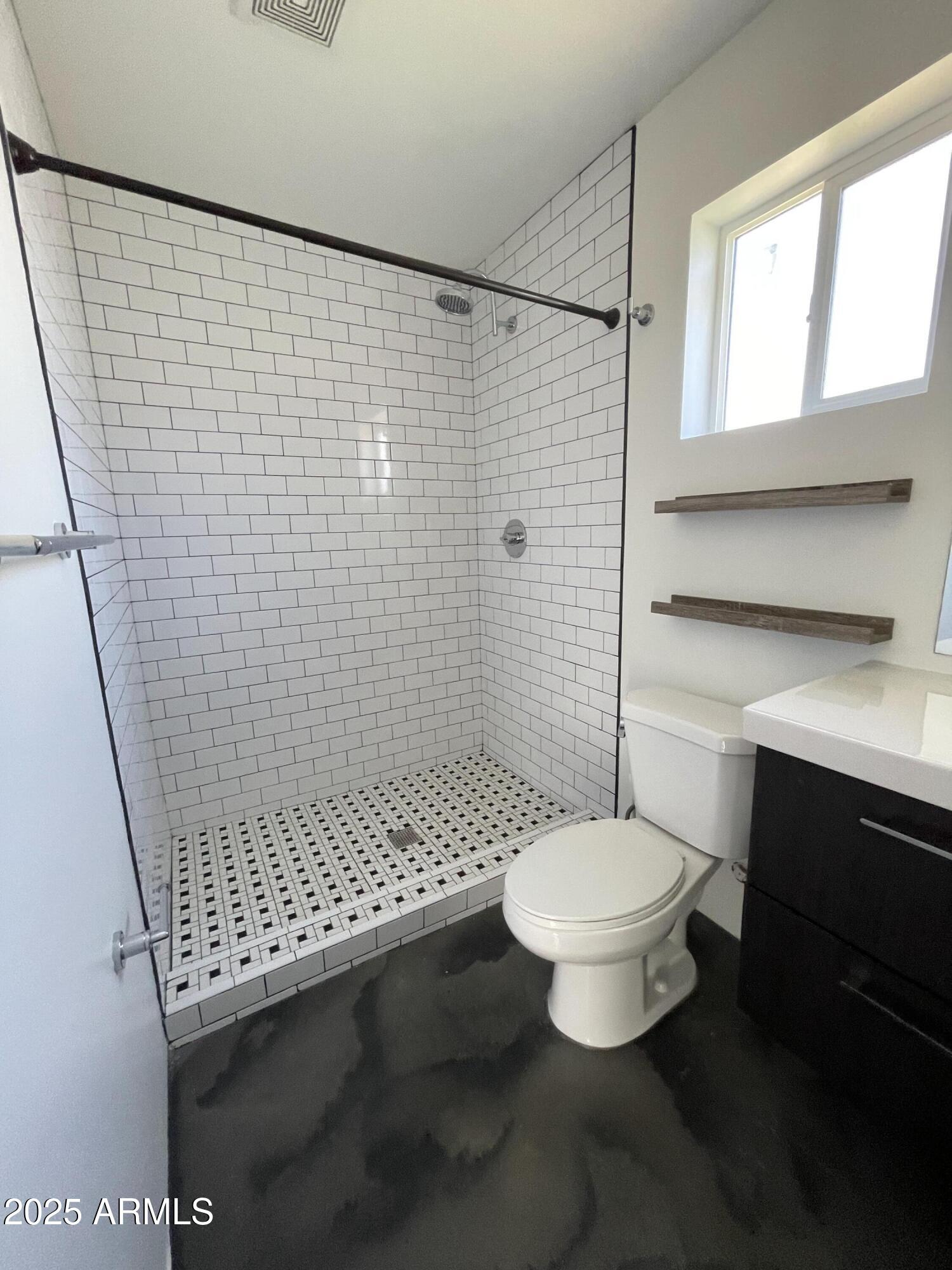 3416 North 37th Street, Unit 3 Phoenix, AZ 85018 - Photo 21 of 22 a bathroom with a sink toilet and shower