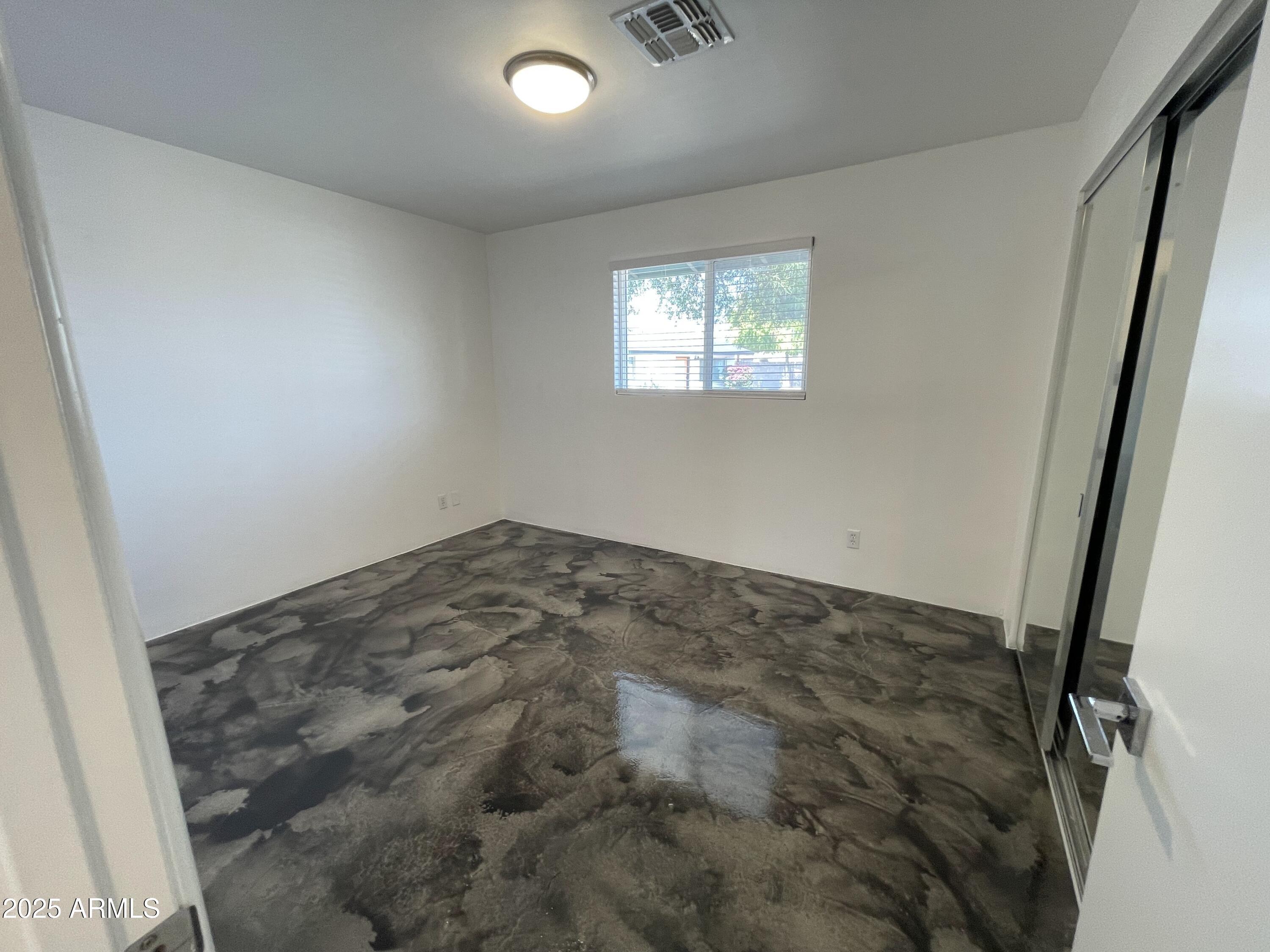 3416 North 37th Street, Unit 3 Phoenix, AZ 85018 - Photo 8 of 22 a view of a big room with wooden floor and windows