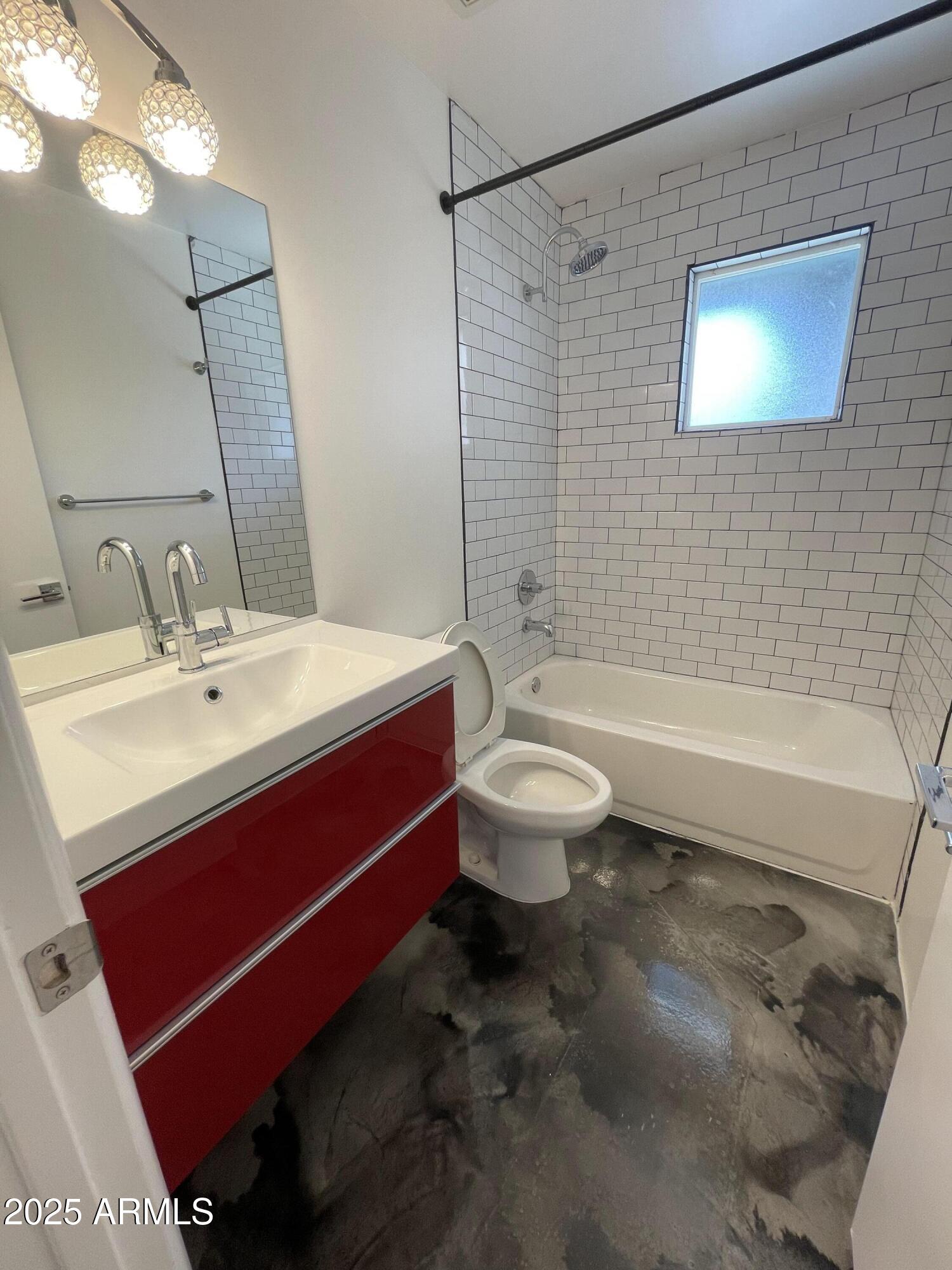 3416 North 37th Street, Unit 3 Phoenix, AZ 85018 - Photo 9 of 22 a bathroom with a sink a toilet and shower